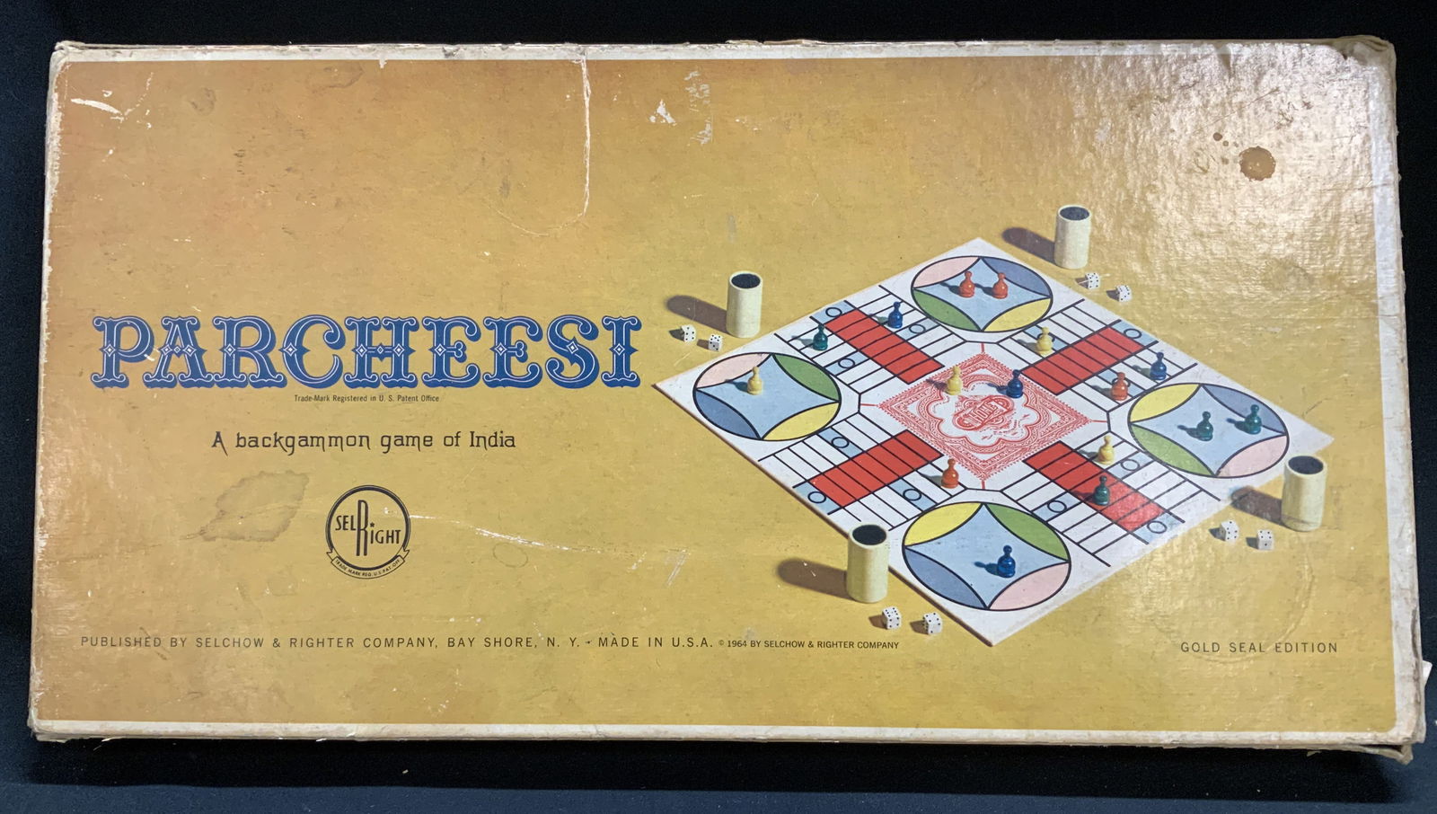1964 Parcheesi Backgammon Game W Box INDIA: Parcheesi. A backgammon game of India. Gold Seal Edition. Comes with original box. Has not been inspected for complete pieces. Published by Selchow & Righter Company, Bay Shore NY. MADE IN USA. 1964.