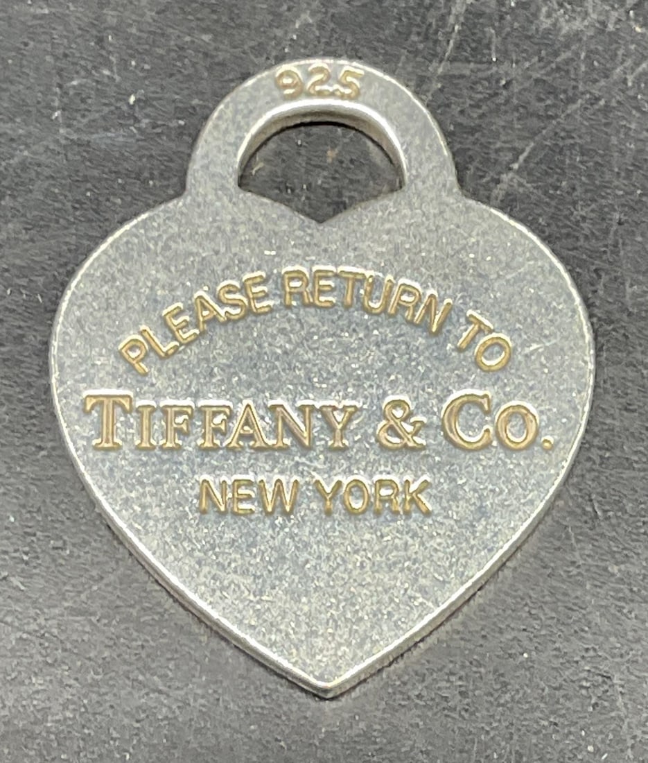 Tiffany & Co Sterling Silver Heart Pendant: Signed Tiffany & Co Sterling silver classic heart pendant. Measures approx. 1 x 7/8 inches. Marked sterling. Total weight 5.6 grams. Some scratching. Jewelry, estate jewelry, fine jewelry, cocktail je