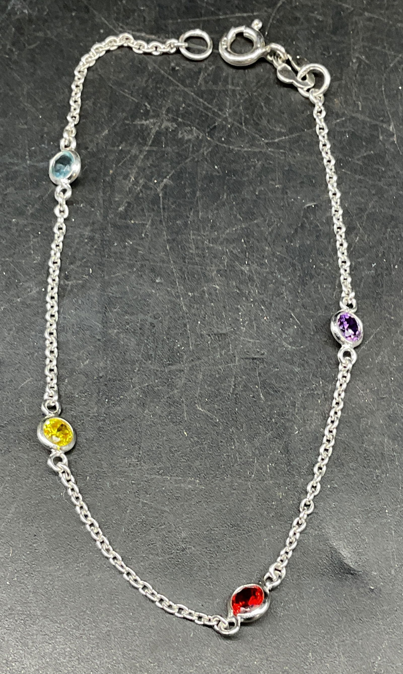 Sterling Silver Semiprecious Bracelet: Sterling silver and multicolor semiprecious stone bracelet. Measures approx. 7.25 inches long. Marked sterling. Total weight 1.8 grams. Some scratching. Jewelry, estate jewelry, fine jewelry, cocktail