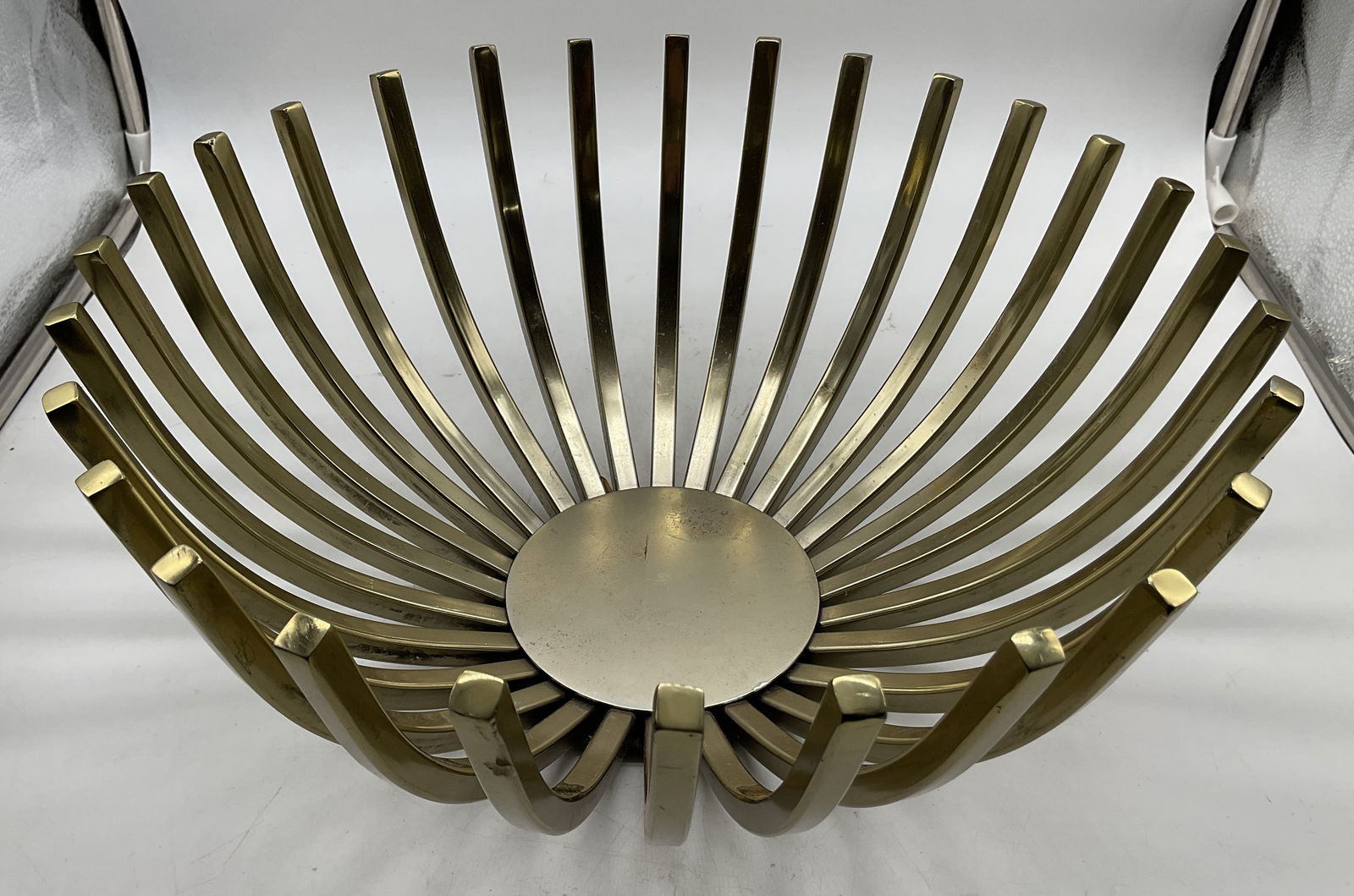 MCM Jupiter Decorative Metal Bowl India: Jupiter decorative metal bowl. Made in India. Gold toned metal. Mid century modern style. Starburst design, vertical rods that curve upwards and outwards from a flat circular base. Measures ht approx