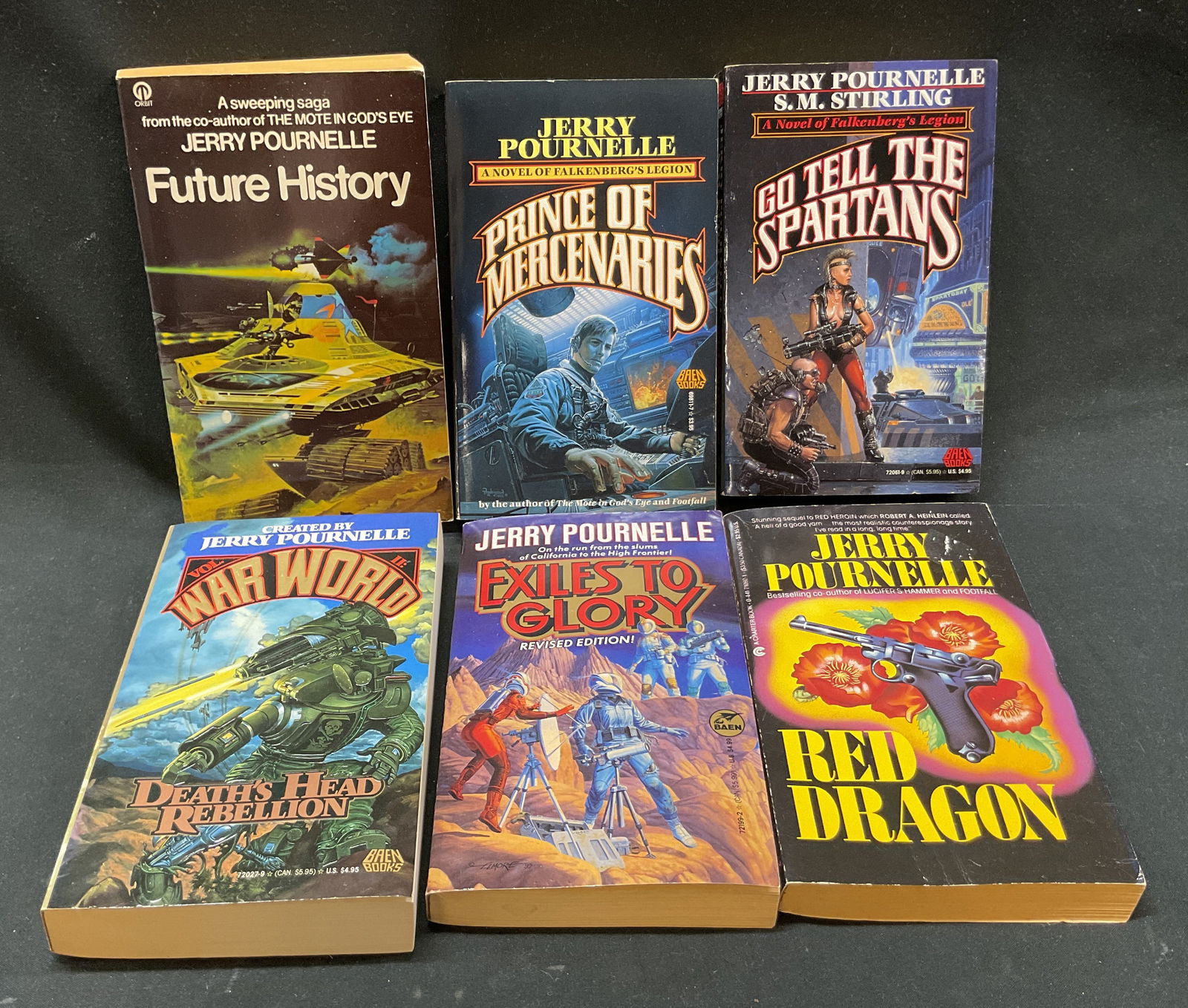 Lot 6 Jerry Pournelle Sci Fi Books 1970s-90s+: Lot of 6 books. Science fiction books by Jerry Pournelle. Titles include Future History (Futura, 1981), Prince Of Mercenaries (Baen Books, 1989), Go Tell The Spartans (Baen Books, 1991), War World Dea