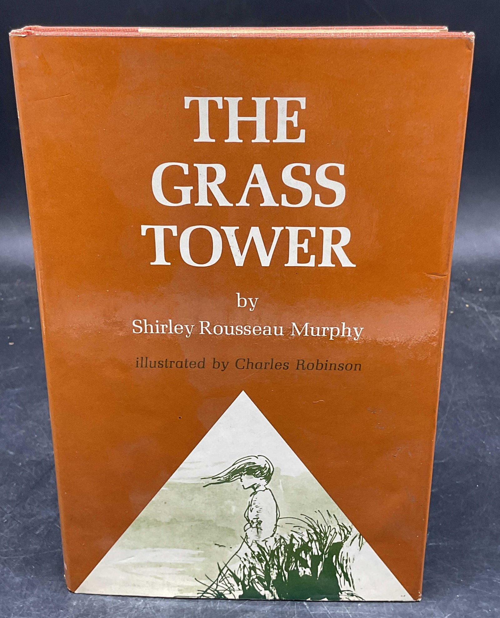 Murphy The Grass Tower 1st Ed Illustr 1976: Hardcover first edition The Grass Tower by Shirley Rousseau Murphy. Illustrated. Atheneum, 1976. Measures approx. 8.5 x 5.75 inches. Some wear to cover, pages, and binding consistent with exposure. Bo