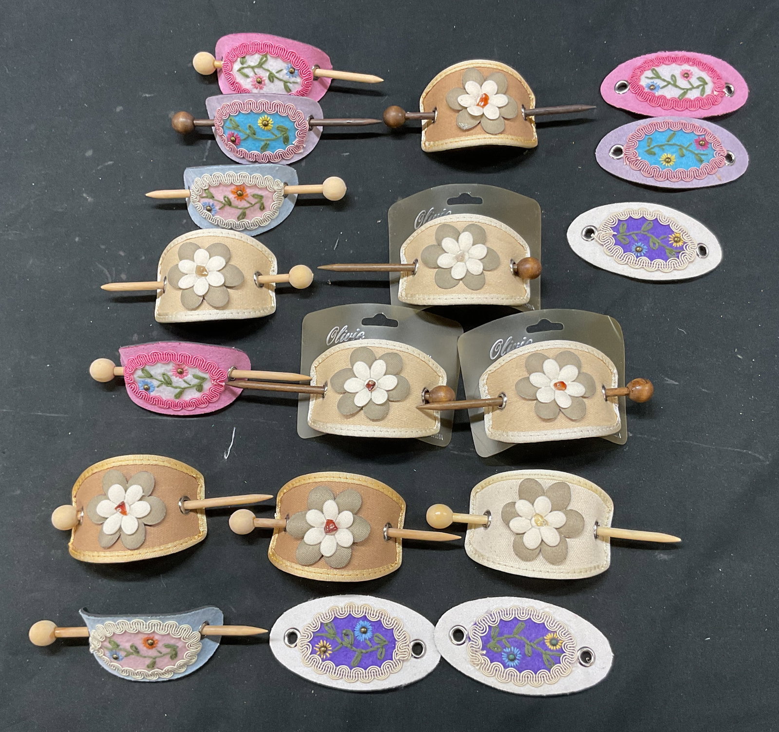 Lot 18 Vintage Fashion Accessories Olivie+ NWT: Lot of 18 vintage fashion accessories. Some are marked Olivie, new with tag. Fabric and leather material. Wooden sticks included. Floral motifs in varying colors. Measures approx 2 x 4 inches. Surface