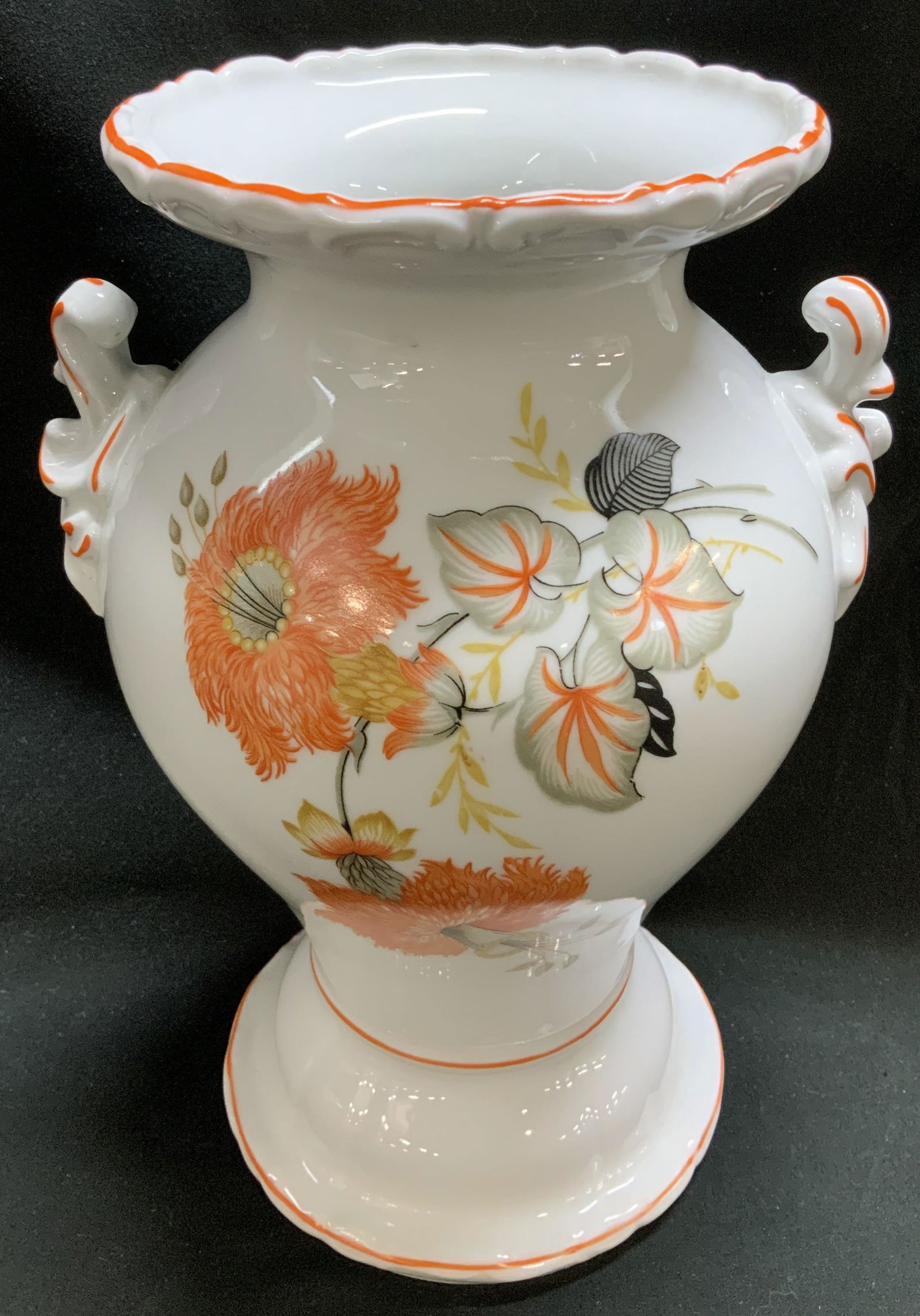 Vtg Hand Painted Floral Motif Porc Vase: Vintage porcelain vase features hand painted orange, yellow & black floral motifs. Stylized handles. Scalloped top. Surface wear consistent to age, use & exposure. No visible signature or