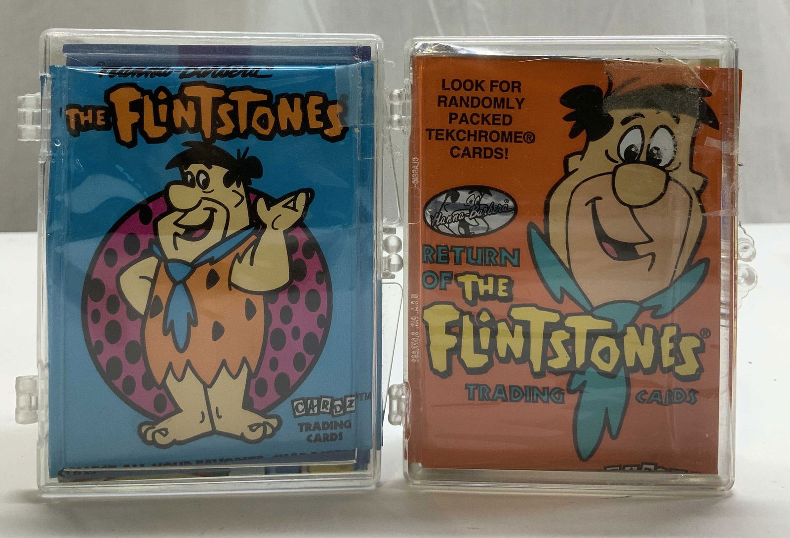 Lot 30+ 1992 & 1995 Flintstone Trading Cards: Lot includes, 20+ 1992 Hanna Barbera The Flintstone trading cards & 15+ 1994 Return of the Flintstone trading cards. Cards come in acrylic case. Cards have not been inspected individually. Sold