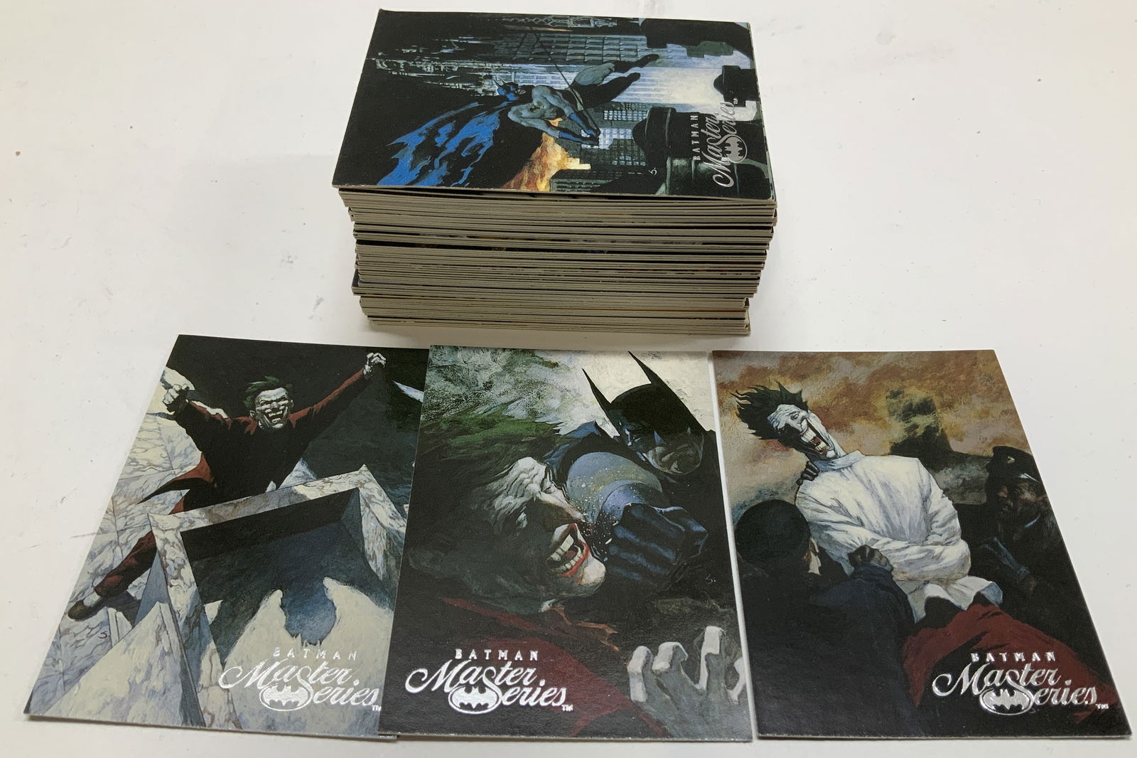 20+ 1995 SkyBox Batman Master Series Trding Crds: Lot 20+ 1995 SkyBox DC Batman Master Series trading cards. Cards feature various illustrations. Have not been examined individually. Signed & marked. Reads, 1995 DC COMICS. Surface wear