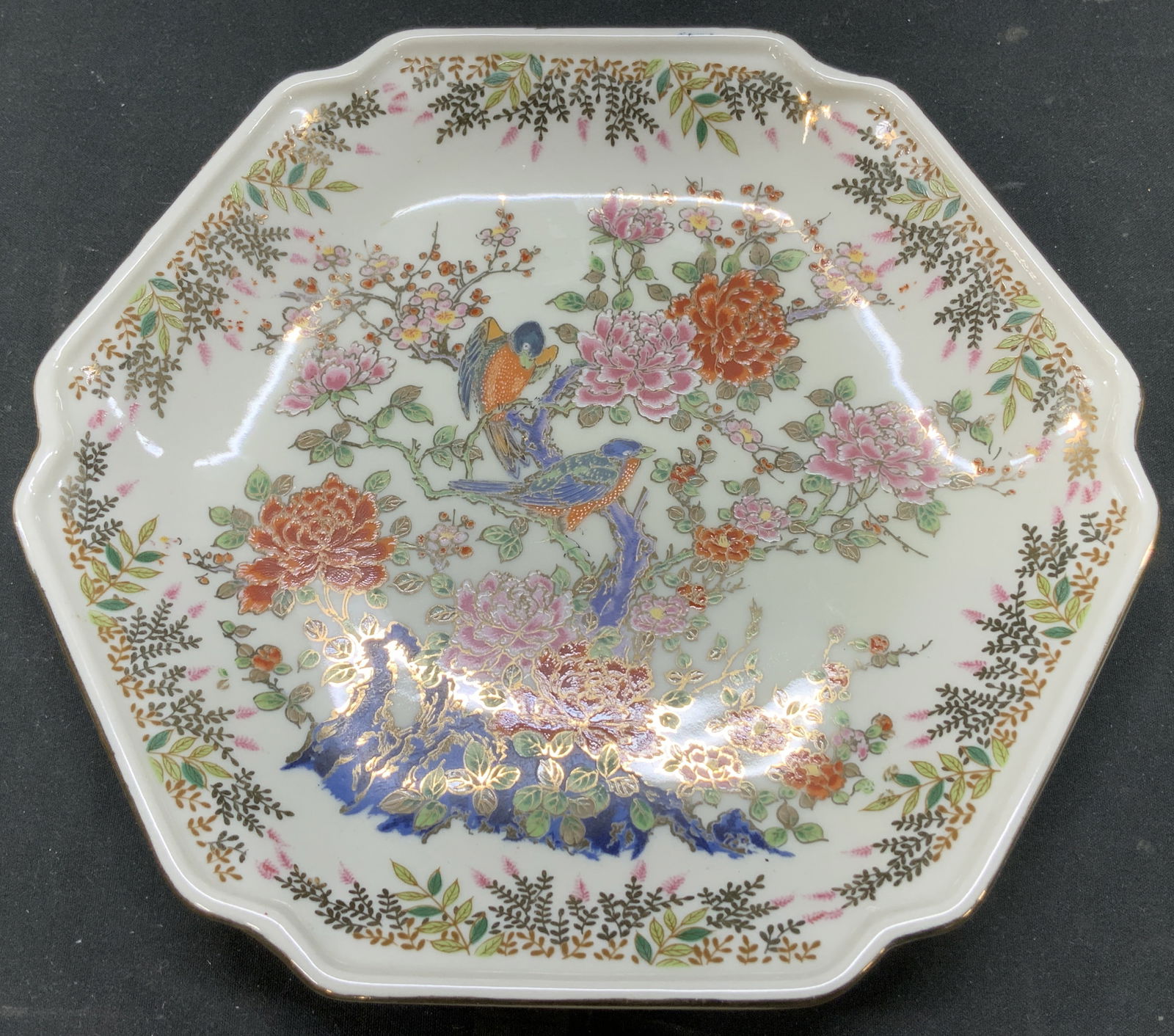 Vtg Bird & Floral Motif Porcelain Plate JAPAN: Vintage porcelain plate features bird & vibrant floral motifs. Hexagonal shape. Gilt accents. Signed & marked on underside. Reads, JAPAN. Visible mark. Surface wear consistent to age, use & exposure.