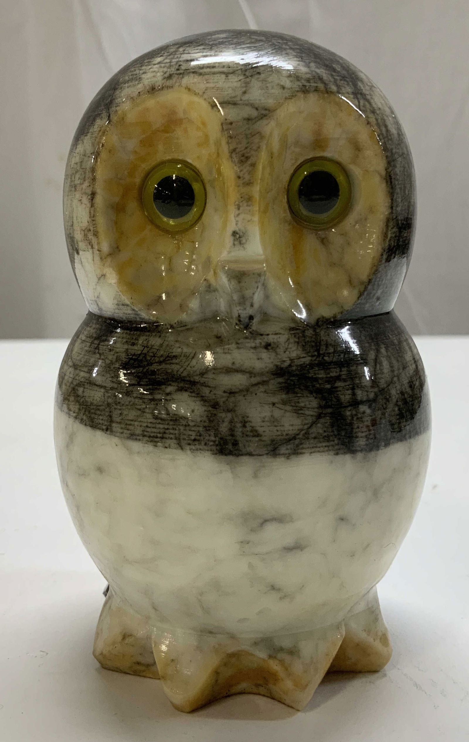 Hand Carved Genuine Alabaster Owl Fig ITALY: Hand carved genuine alabaster owl figurine features black, white & yellow toned. Yellow eyes. Signed & marked on underside. Reads, GENUINE ALABASTER. HAND CARVED MADE IN ITALY. Surface wear