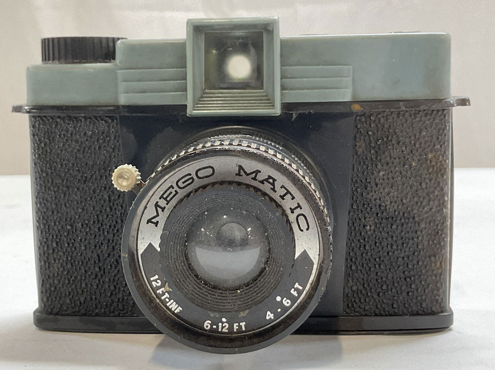 Vtg Mego Matic Plastic Toy Camera Hong Kong: Vintage Mego Matic plastic toy camera. Marked made in Hong Kong. Reads Mego Matic 12 FT INF 6-12 Ft 4-6 Ft. Similar to a Diana camera. Measures approx 3 x 5 x 3.5 inches. Not tested for function.