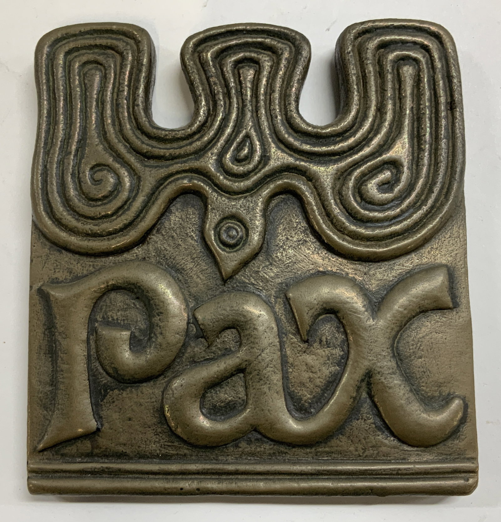 Wild Goose Studio Dove of Peace Plaque IRELAND: Wild Goose Studio Dove of Peace plaque, handcrafted in Ireland and designed by sculptor Ken Thompson. It features a Celtic-inspired dove motif and the Latin word Pax (peace). Ceramic material. Surface