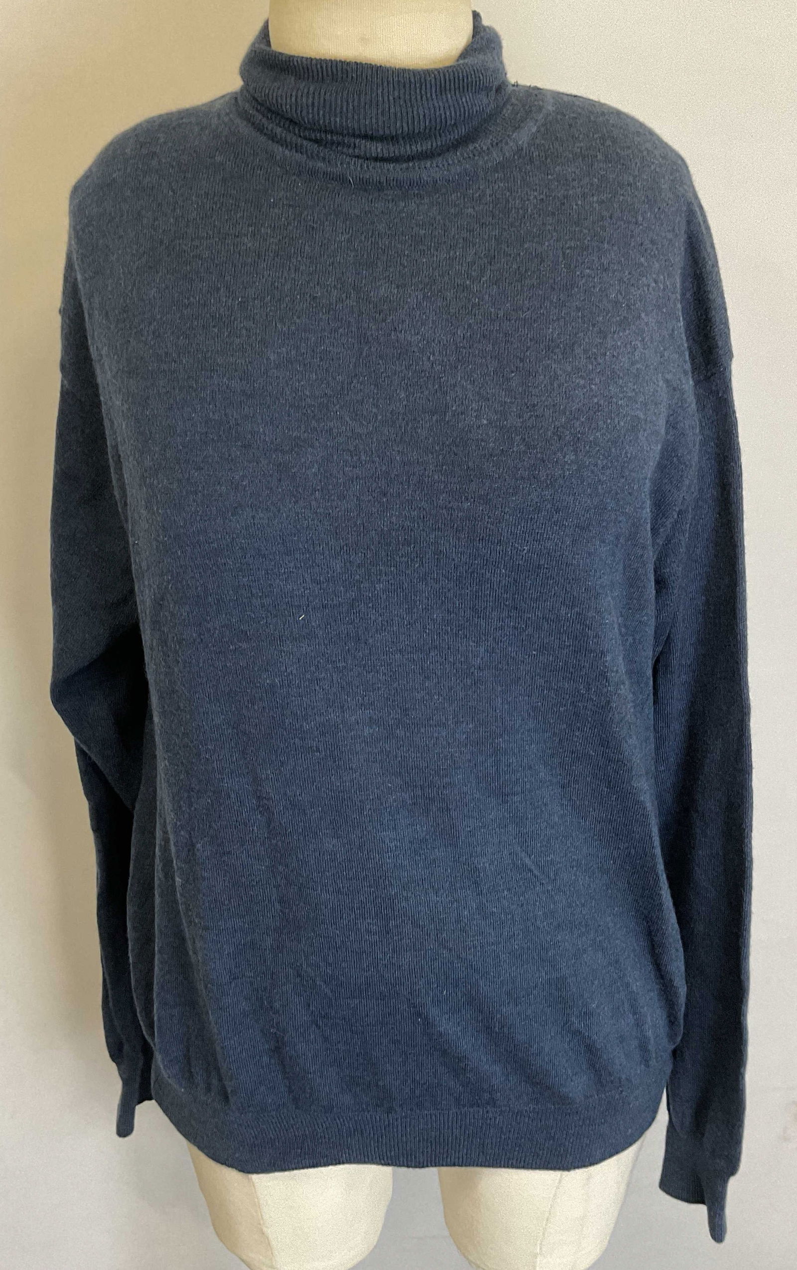 Metropolitan View Turtleneck Sweater Hong Kong: Metropolitan View blue wool turtleneck sweater. Size M. 100% wool material. Made in Hong Kong. Ribbed surface. Wear consistent with exposure. Property of Upper East Side French stage and screen