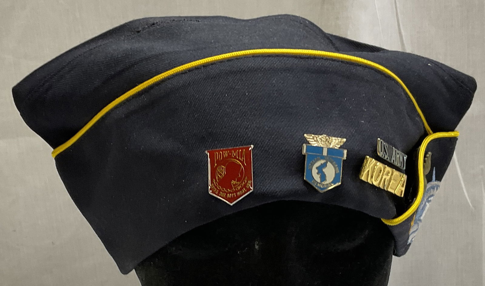 American Legion Overseas Cap W Pins: American Legion Overseas Cap with Statue of Liberty embroidered. Pins on the cap from U.S. Korean War. Includes red Prisoner of War pin, blue Korean Veterans Memorial pin, U.S. Army pin, Korea