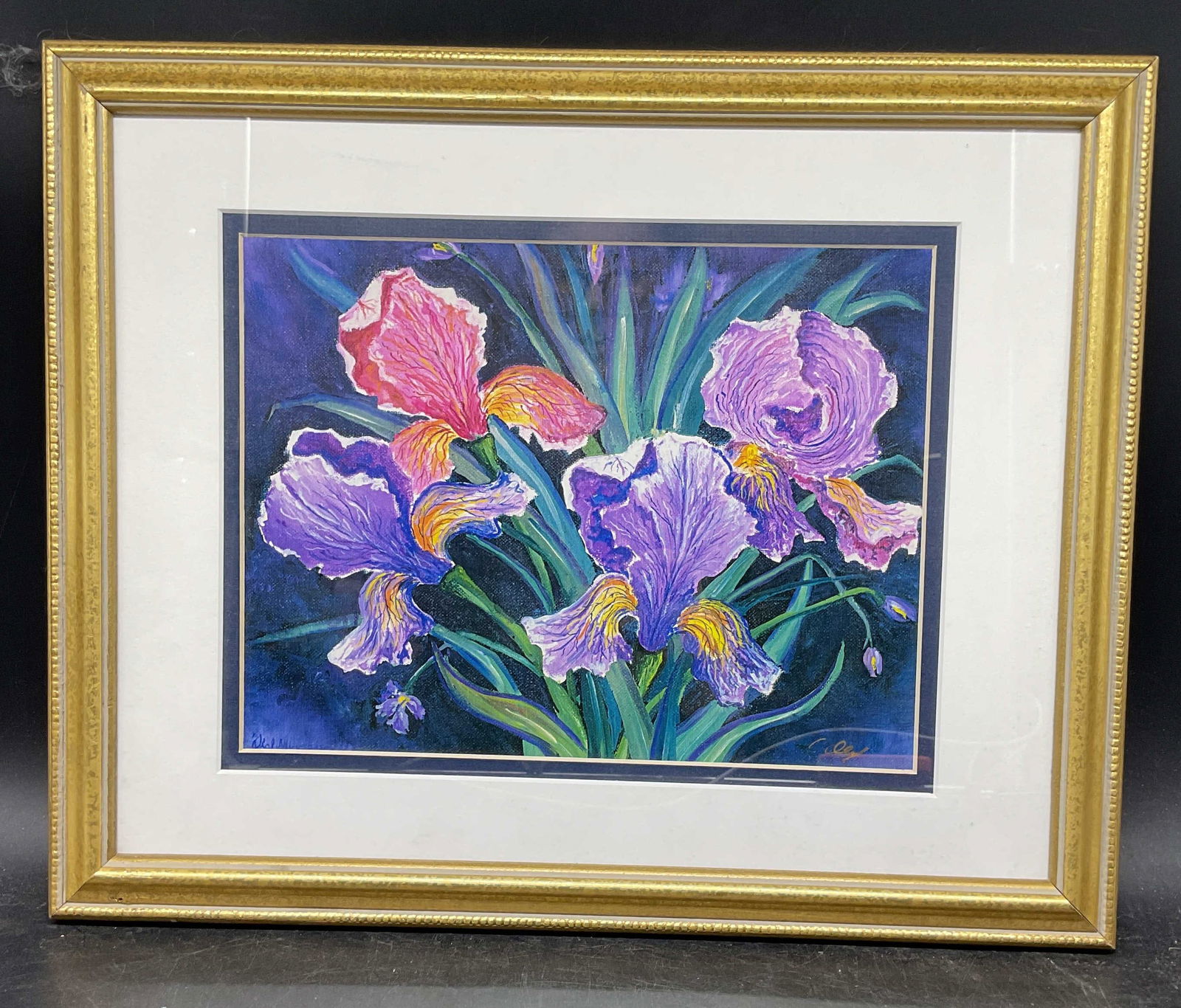 Framed Signed Irises Flowers Fine Art Print: Framed and matted fine art print. Signed lower right, illegible. Iris flowers. Gold tone wood frame. Not examined out of frame. Frame measures approx. 12.75 x 15.5 inches. Some wear consistent