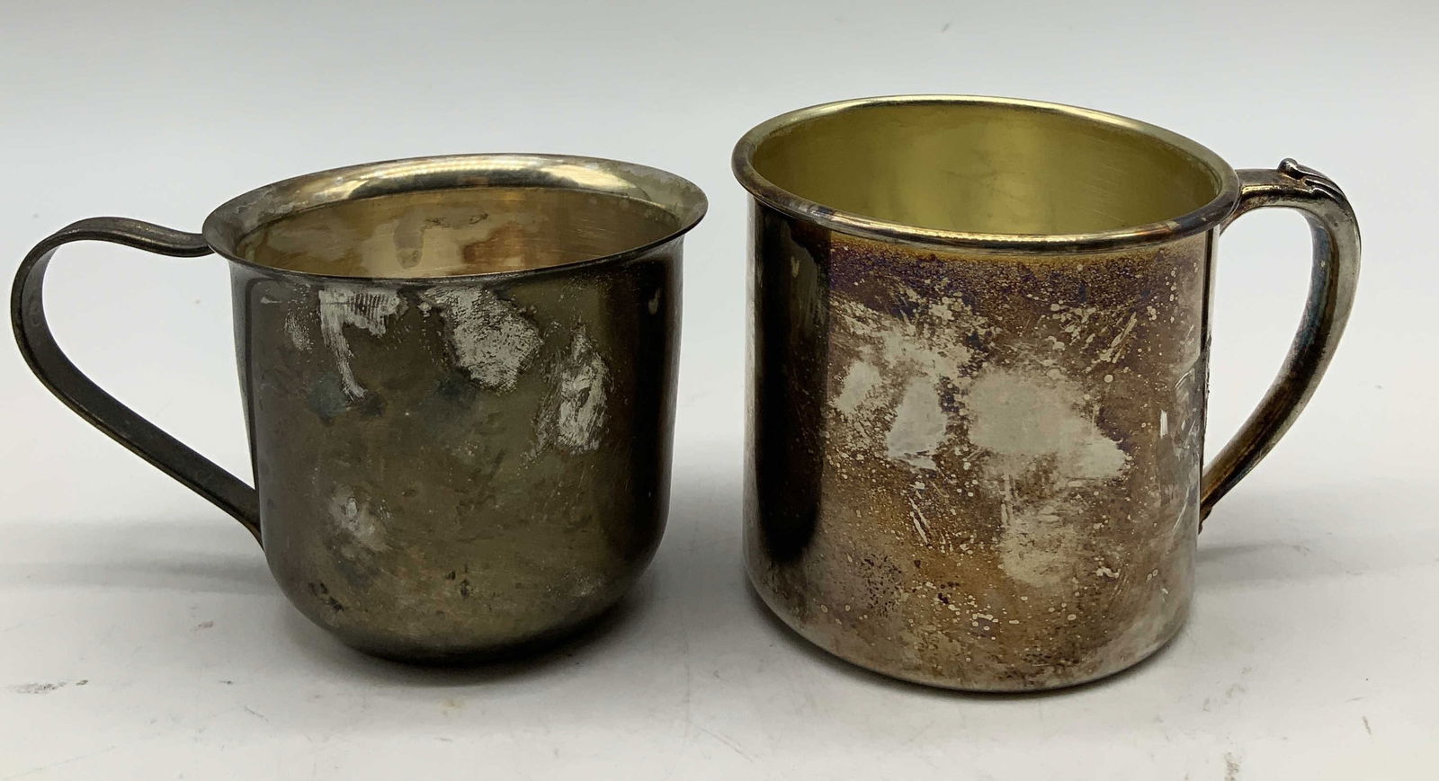 Lot 2 Vtg Silver Plated Cups ONEIDA USA+: Lot includes, 2 Vintage silver plated cups. 1 Oneida cup with a gold colored interior. Signed & marked on underside. Reads, ONEIDA USA. Surface wear consistent to age, use & exposure.