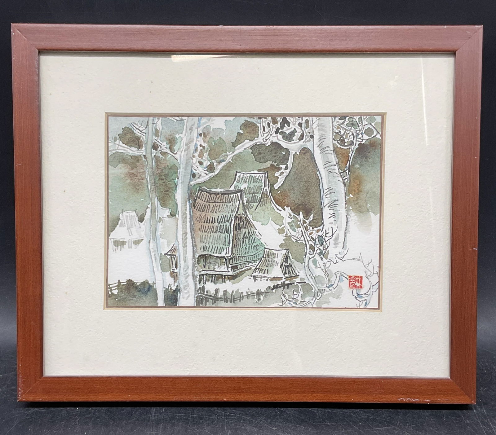 Signed Japanese Rural House Watercolor Painting: Framed and matted watercolor painting. Signed lower right. Rural scene with landscape and houses. Wood frame. Not examined out of frame. Frame measures approx. 9 x 11 inches. Some wear consistent