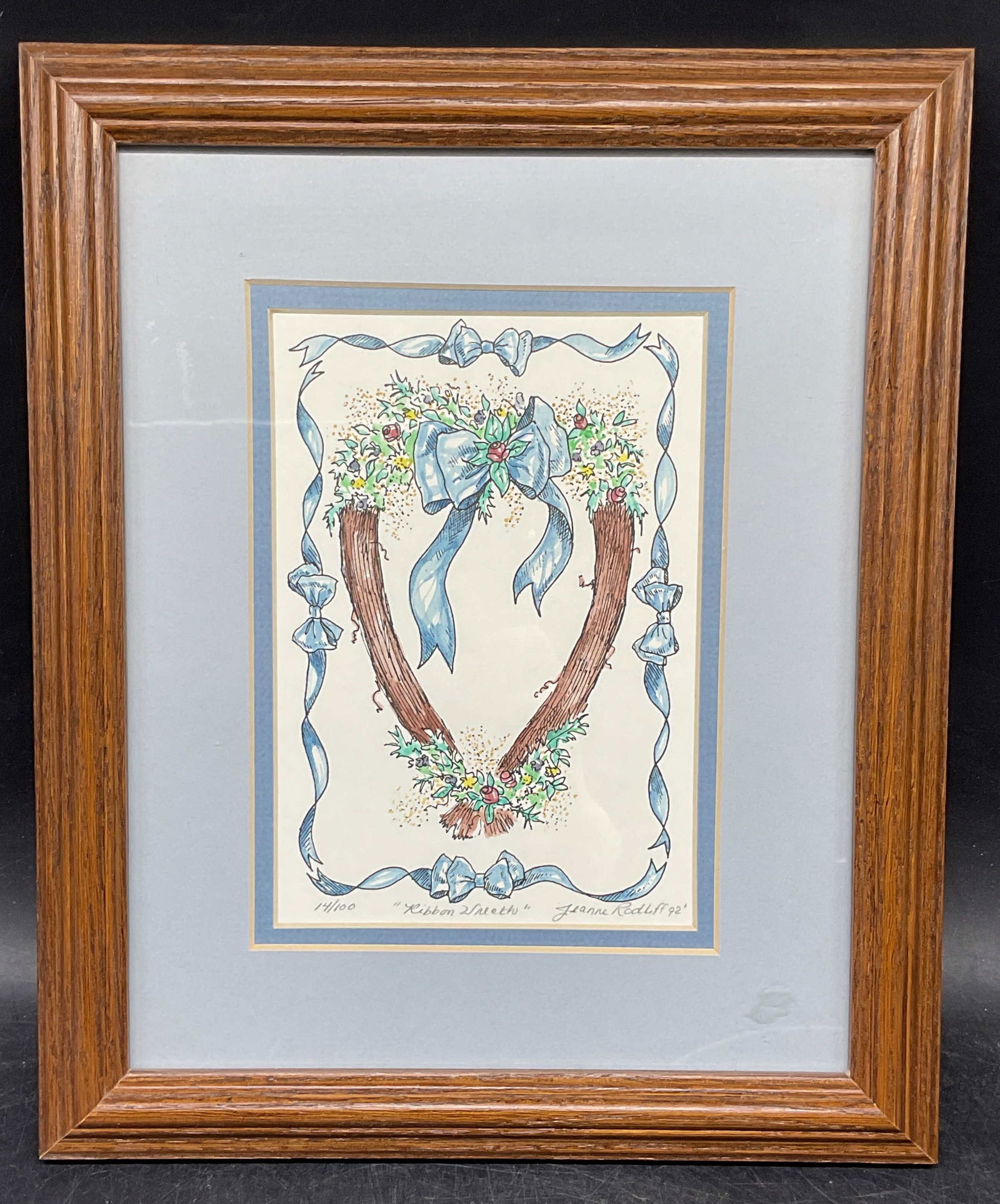Signed Jeanne Rodliff Ribbon Wreath Ltd Edt Print: Framed and matted fine art print. Signed lower right, Jeanne Rodliff. Ribbon wreath. Edition number 14/100. Wood frame. Not examined out of frame. Frame measures approx. 11.75 x 9.75 inches. Some