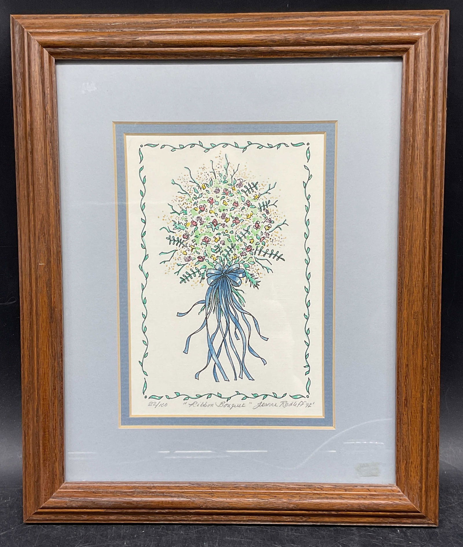 Sgn Jeanne Rodliff Ribbon Bouquet Ltd Edt Print: Framed and matted fine art print. Signed lower right, Jeanne Rodliff. Ribbon Bouquet. Edition number 22/100. Wood frame. Not examined out of frame. Frame measures approx. 11.75 x 9.75 inches. Some wea