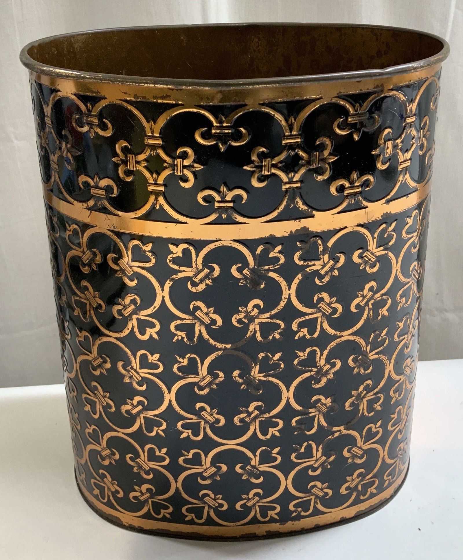 Vtg Sgnd Fluer De Lis Pattern Vessel 12.7in: Vintage vessel features a copper toned & black finish with fleur-de-lis pattern. Metal material. Signed & marked on underside. Not legible. Sold as is. Surface wear consistent to age, use &