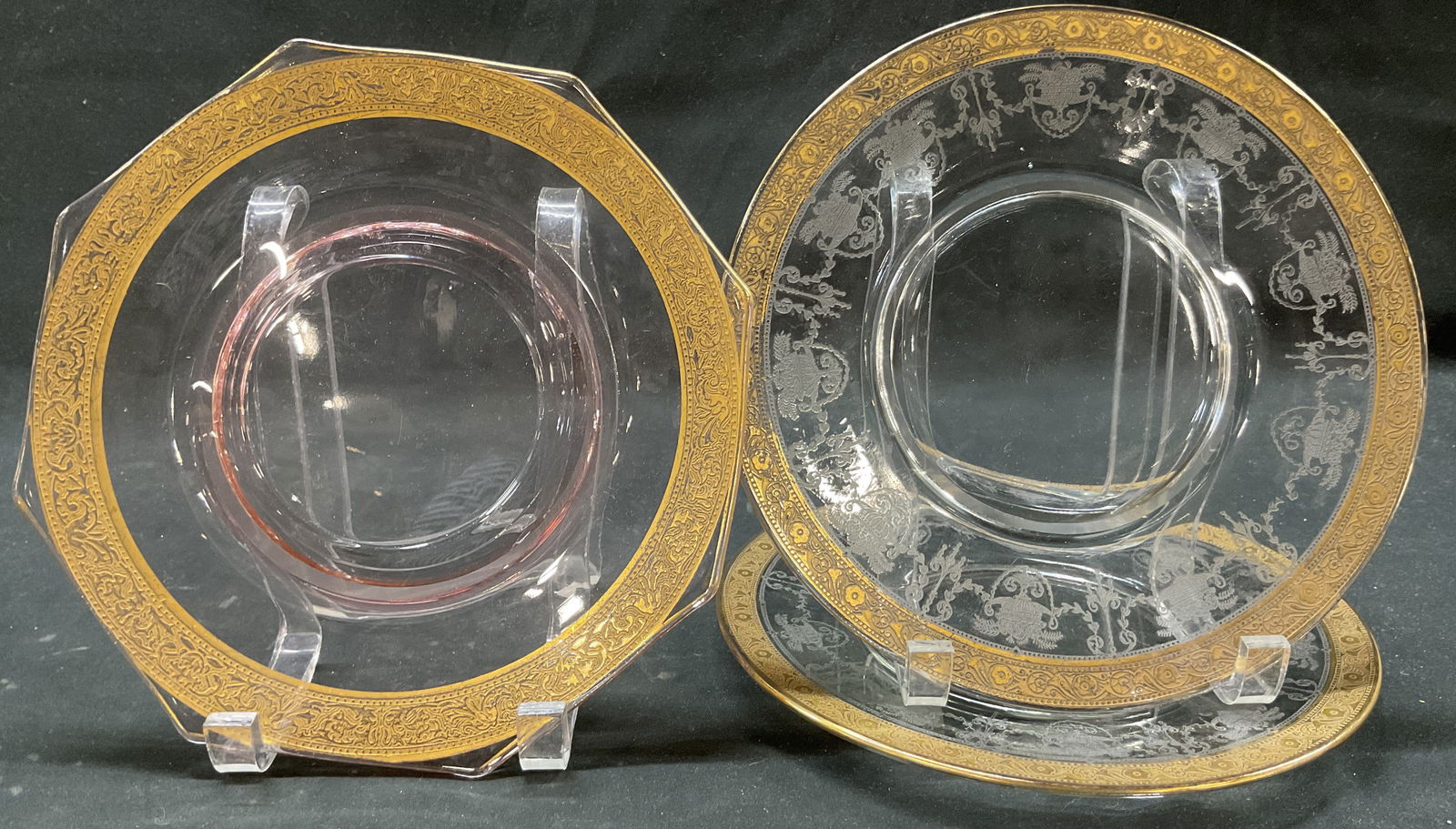 Lot 3 Vtg Etched Glass Gilt Rim Plates: Lot of 3 vintage etched glass gilt rim plates. Round and curved edges. Gilt decorated rims with embossed floral and scroll motifs. Etched floral and scroll motifs. Measures approx 8.5 inches in
