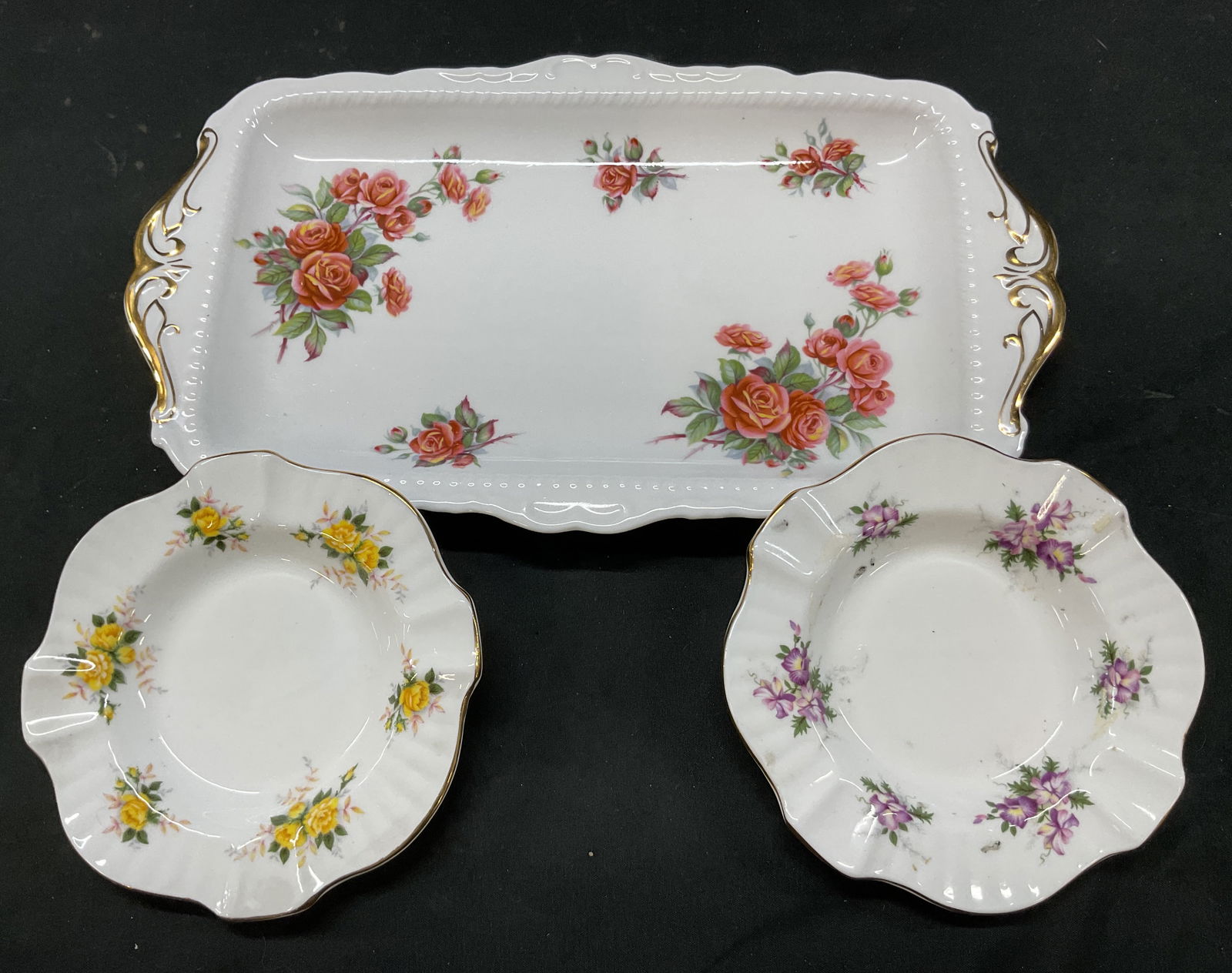 Lot 3 Royal Albert+ Trinket Dishes England: Lot of 3 items. Royal Albert trinket tray. Marked on underside, reads Royal Albert Bone China England Centennial Rose. Scalloped edges and ribbed surface. Gilt accents. Centennial Rose pattern in
