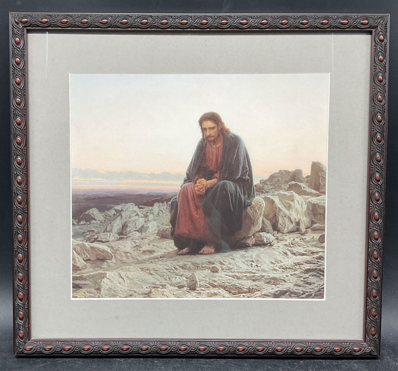 Framed Kramskoi Christ In The Desert Litho: Framed lithograph. Christ In The Desert by Ivan Nikolaevich Kramskoi. Label on verso. Decorative wood frame. Not examined out of frame. Frame measures approx. 11.75 x 12.75 inches. Some wear consisten