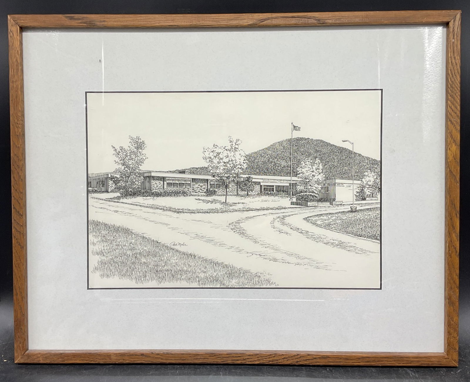 Signed Pat Mohr Elementary School Ink Drawing: Framed and mated ink drawing. Signed Pat Mohr. Round Hill Elementary School facade. Wood frame. Not examined out of frame. Frame measures approx. 14.75 x 18.75 inches. Some wear consistent with