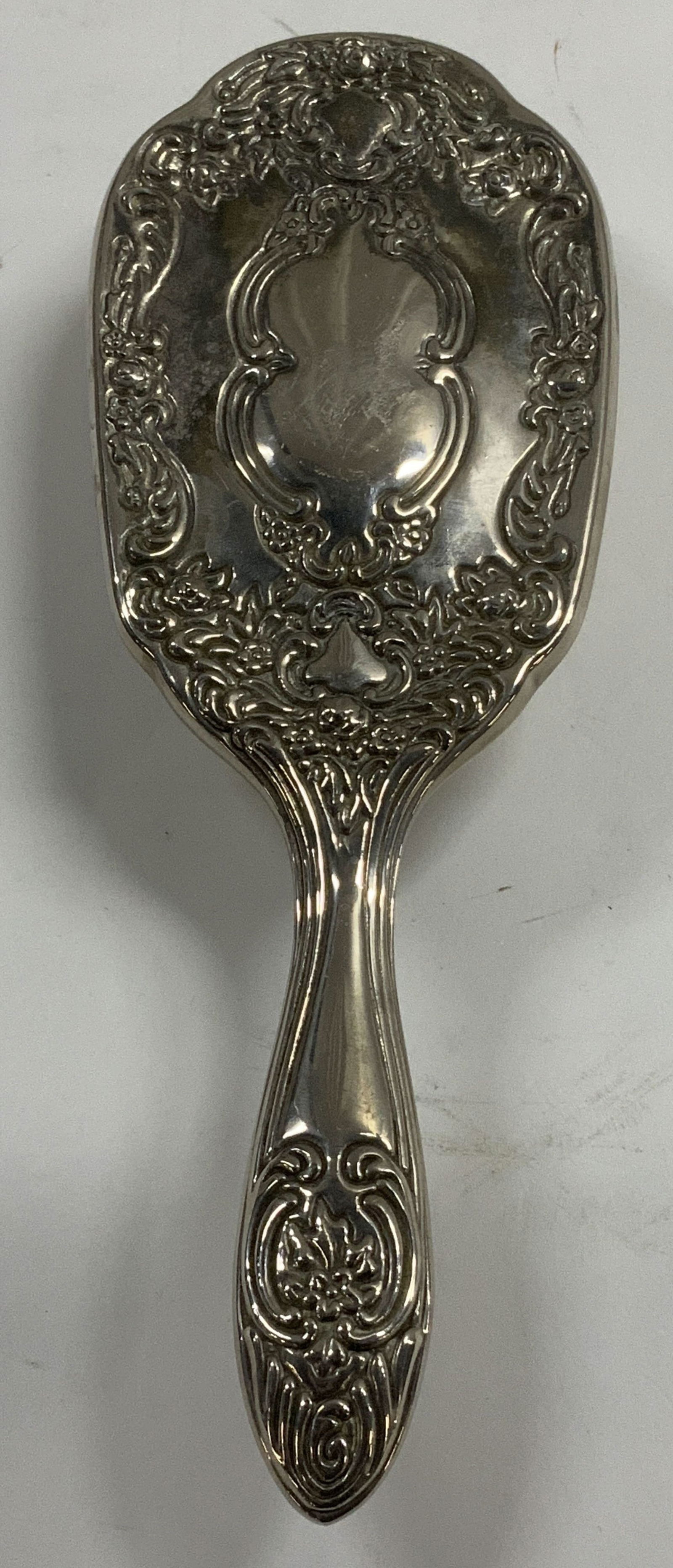 Vtg Silver Plated Ornate Hair Brush: Vintage silver plated hair brush features ornate floral & scrollwork detailing. Textured details. No visible signature or markings. Surface wear consistent to age, use & exposure. Measurements: length