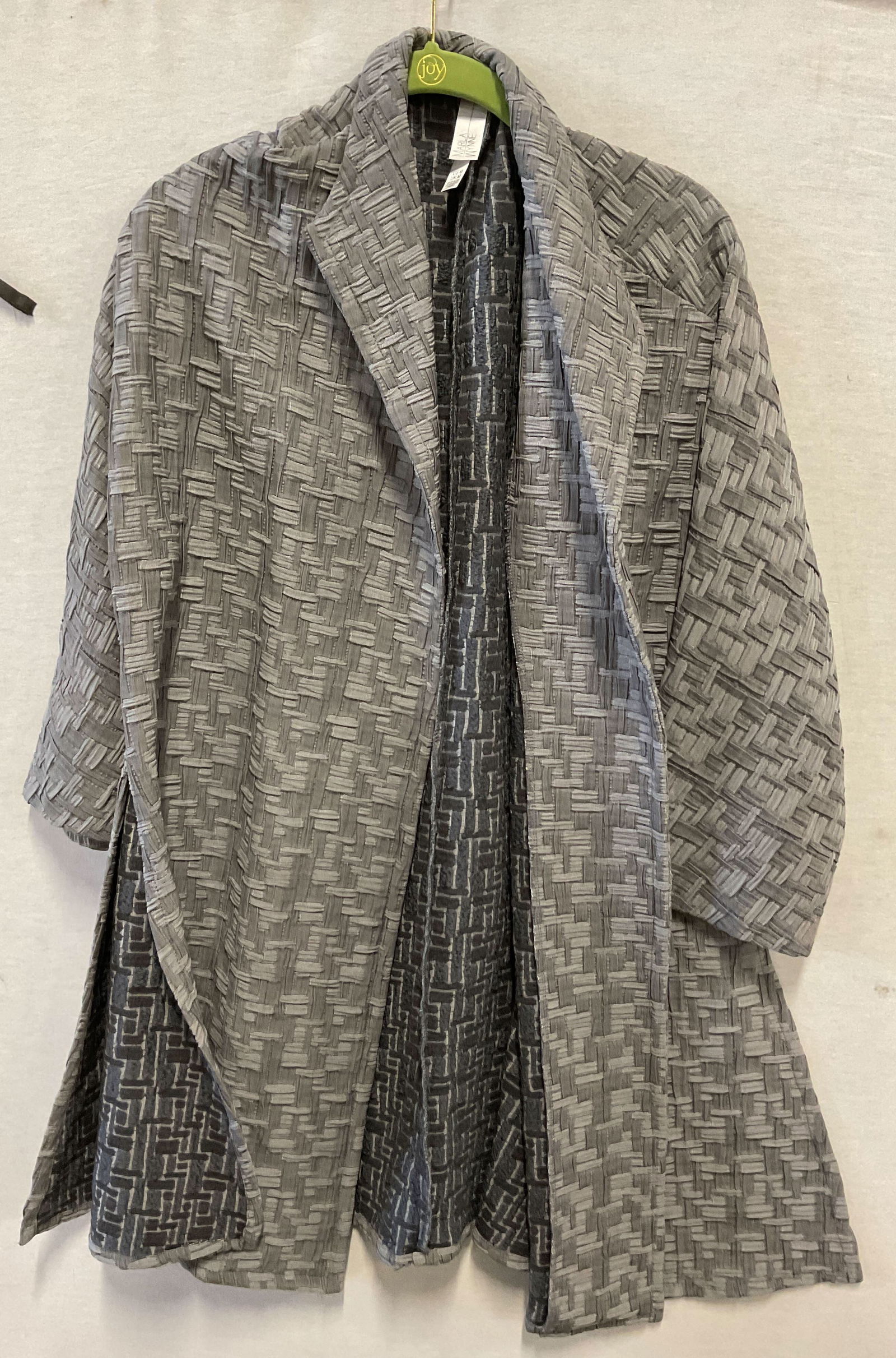 Marla Wynne Grey Geometric Cardigan USA: Marla Wynne grey geometric cardigan. Made in USA. Cotton feel. Size M. Collared. Textured geometric pattern. Split seam on either side. Flowy style. Wear consistent with exposure. Cardigan, Marla Wynn