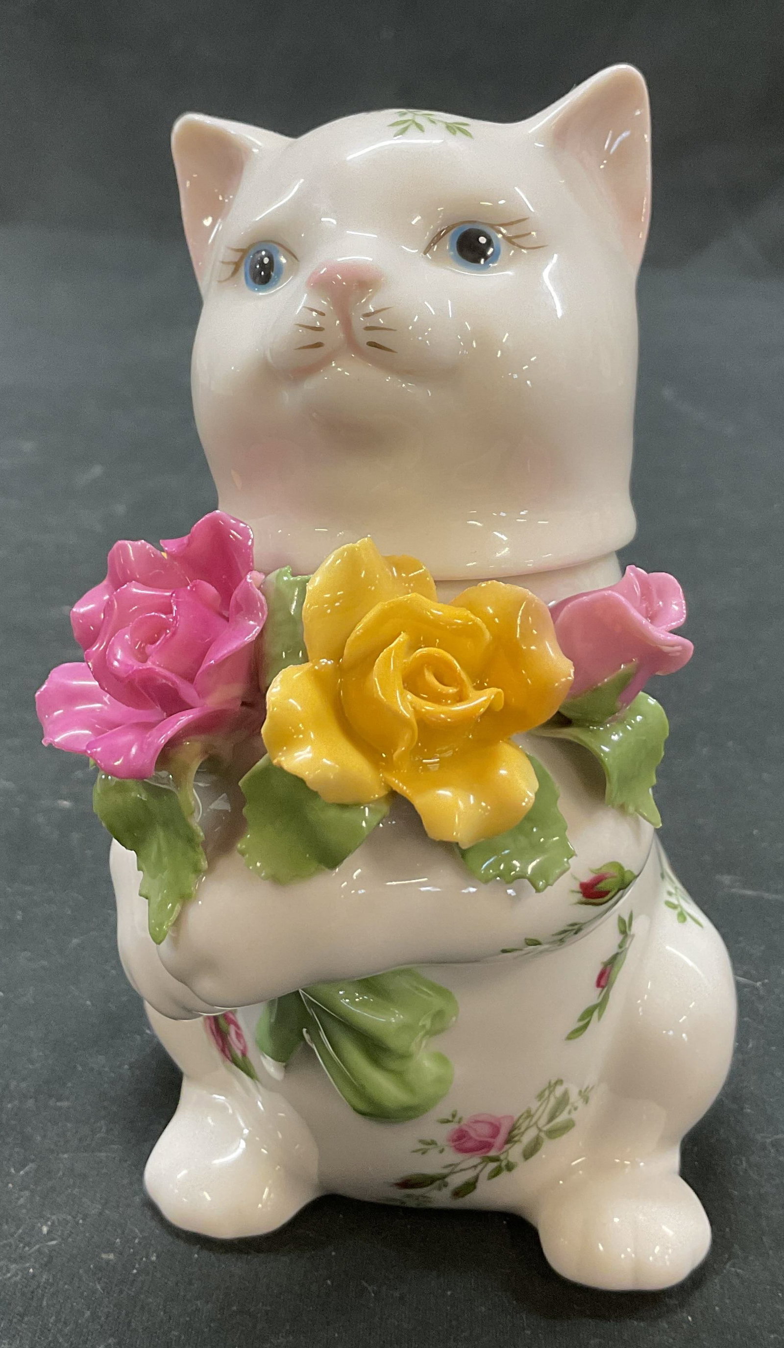 1962 Royal Albert Old Country Roses Cat Sugar Bowl: Royal Albert Old Country Roses porcelain cat lidded sugar bowl. Marked on underside, reads Royal Albert Old Country Roses 1962 Royal Albert Ltd. Cat figure holding a bouquet of flowers. Old Country Ro