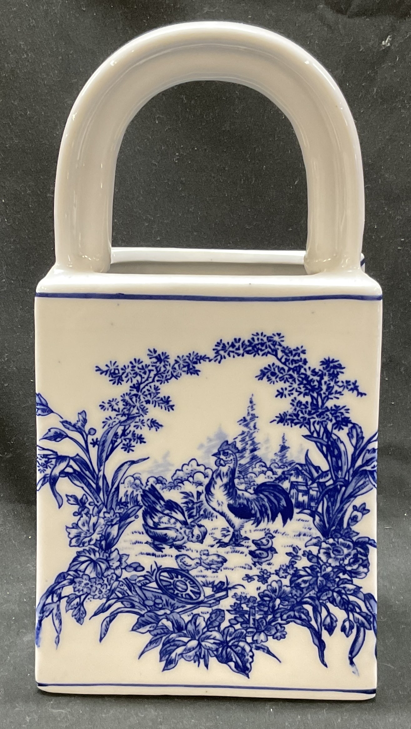 Baum Bros. Blue and White Chickens Bag-Shaped Vase: Baum Bros. Blue and White Chickens Bag-Shaped Vase. Marked Formalities by Baum Bros. TM. Made of glazed ceramic. Features a cobalt blue decorative barnyard scene of a rooster and chicken.