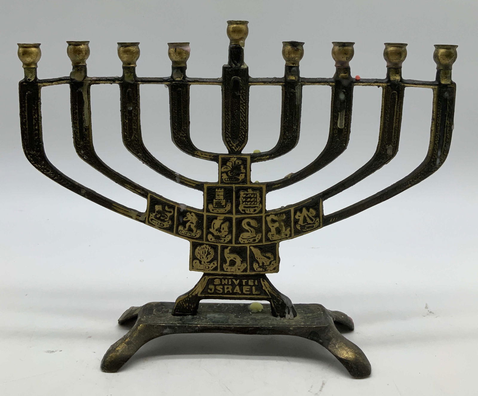 Vtg Hand Crafted Hanukkah Menorah JERUSALEM: Vintage Hanukkah menorah is hand crafted & is adorned with symbols. 9 arms. Hanukkah Menorah reads, Shivtel Israel. Signed & marked on underside. Reads, Copper Hand Crafted Jerusalem. Surface