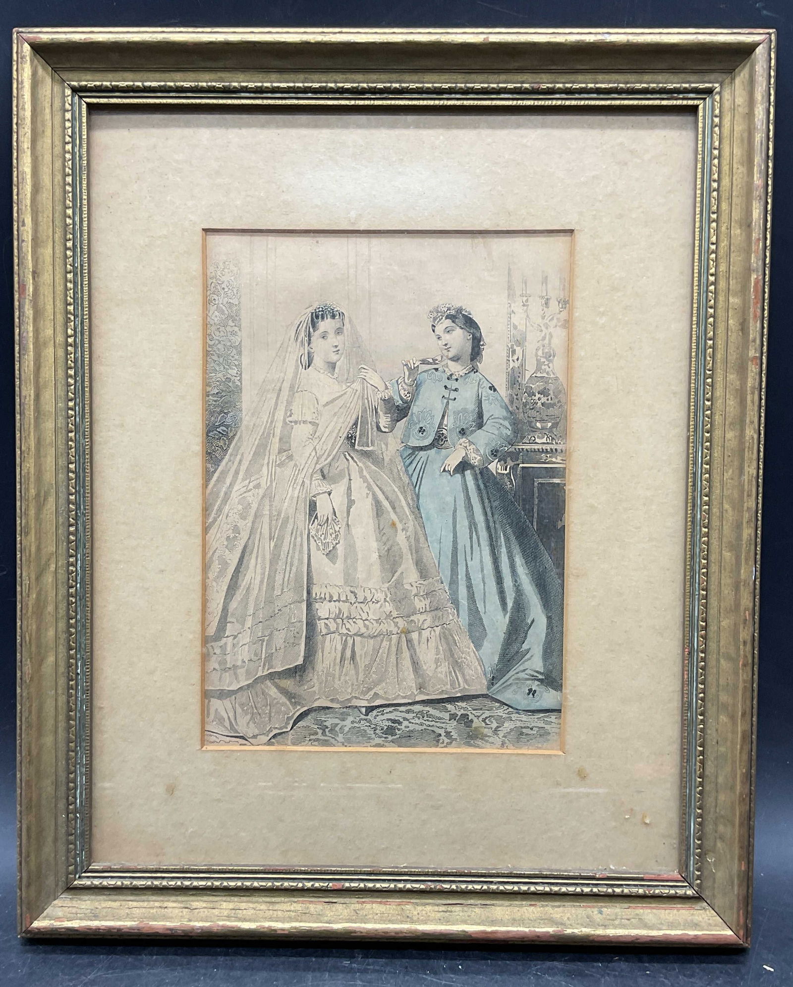 Antique 19th Cen Bridal Fashion Engraving: Framed and matted antique hand colored engraving. Published circa 19th century. Bridal fashion. Gilt wood frame. Not examined out of frame. Frame measures approx 12.5 x 10.25 inches. Wear including fo