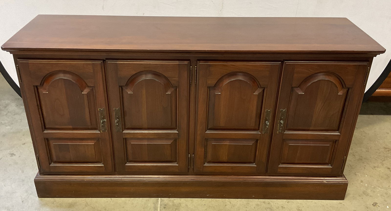 Ethan Allen Georgian Court Cherry Sideboard: Ethan Allen Georgian Court solid cherry wood sideboard. Paneled doors. Signed. Measures approx. 50 x 15 x 26 inches. Wear including scratching. Ethan Allen sideboard, Georgian court sideboard, sideboa