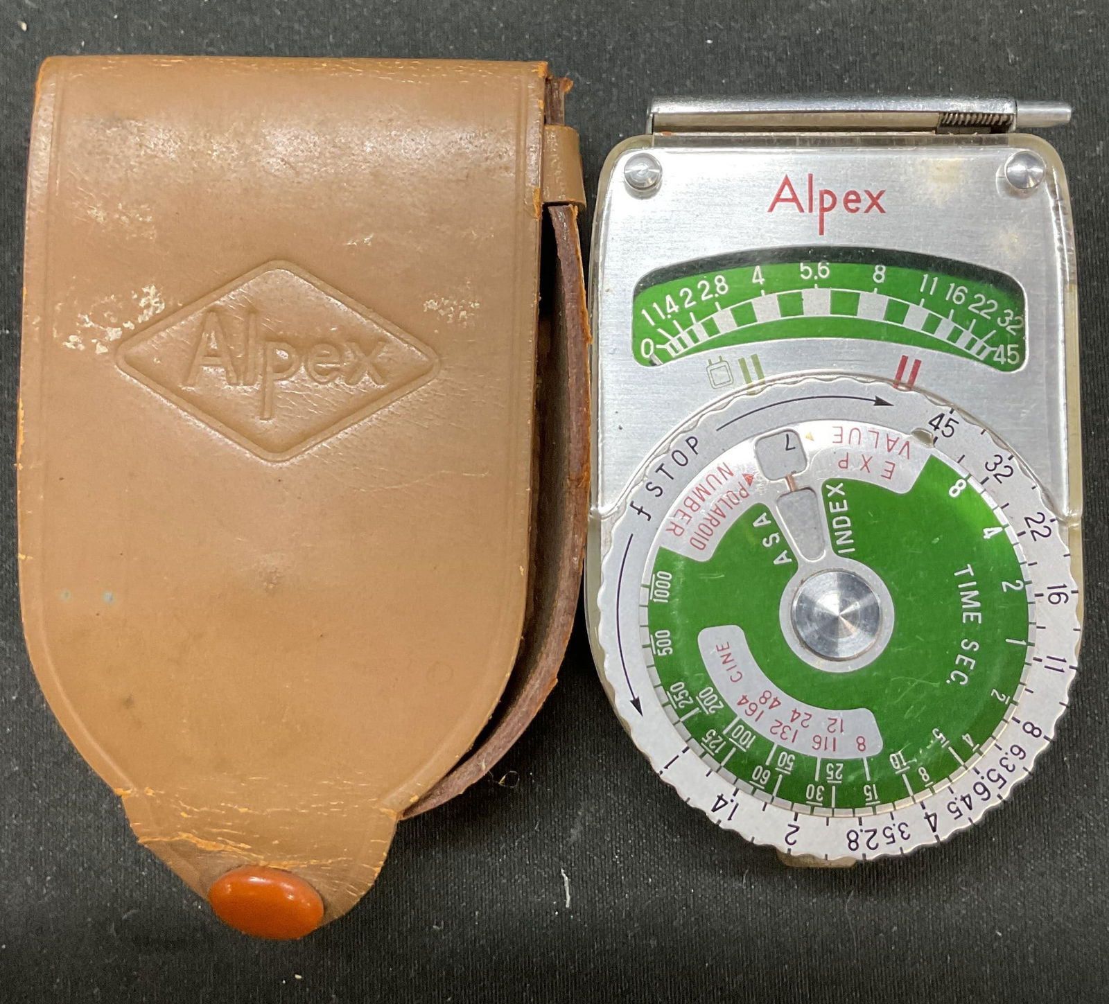 C1950s-60s Alpex Handheld Light Meter Japan W Case: Circa 1950s-1960s. Alpex photographic handheld light meter. Made in Japan. Green and white dial design. Selenium cell powered light meter. Various settings. Reads as photographed here. Comes with case