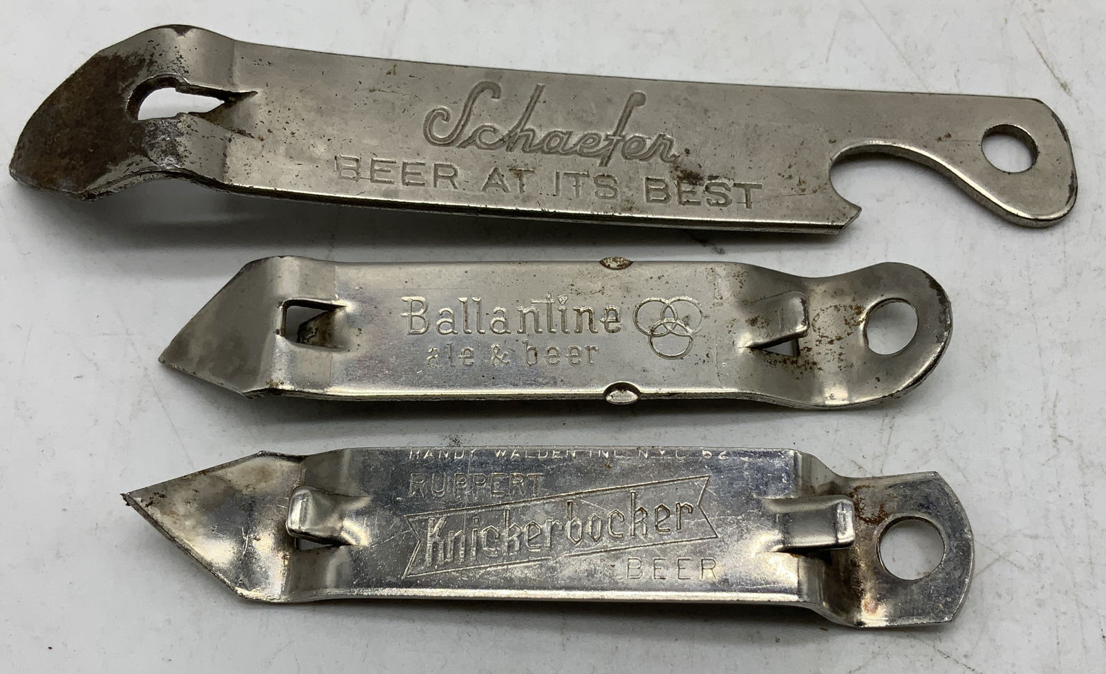 Lot 3 Vtg Promotional Beer Can Openers SCHAEFER+: Lot includes, 3 vintage silver toned promotional beer can openers. Openers vary in size & brand. Reads, SCHAEFER BEERT AT ITS BEST CANCO KEGLINED, BALLANTINE ALE & BEER, RUPPERT KNICKERBOCKER BEER. So