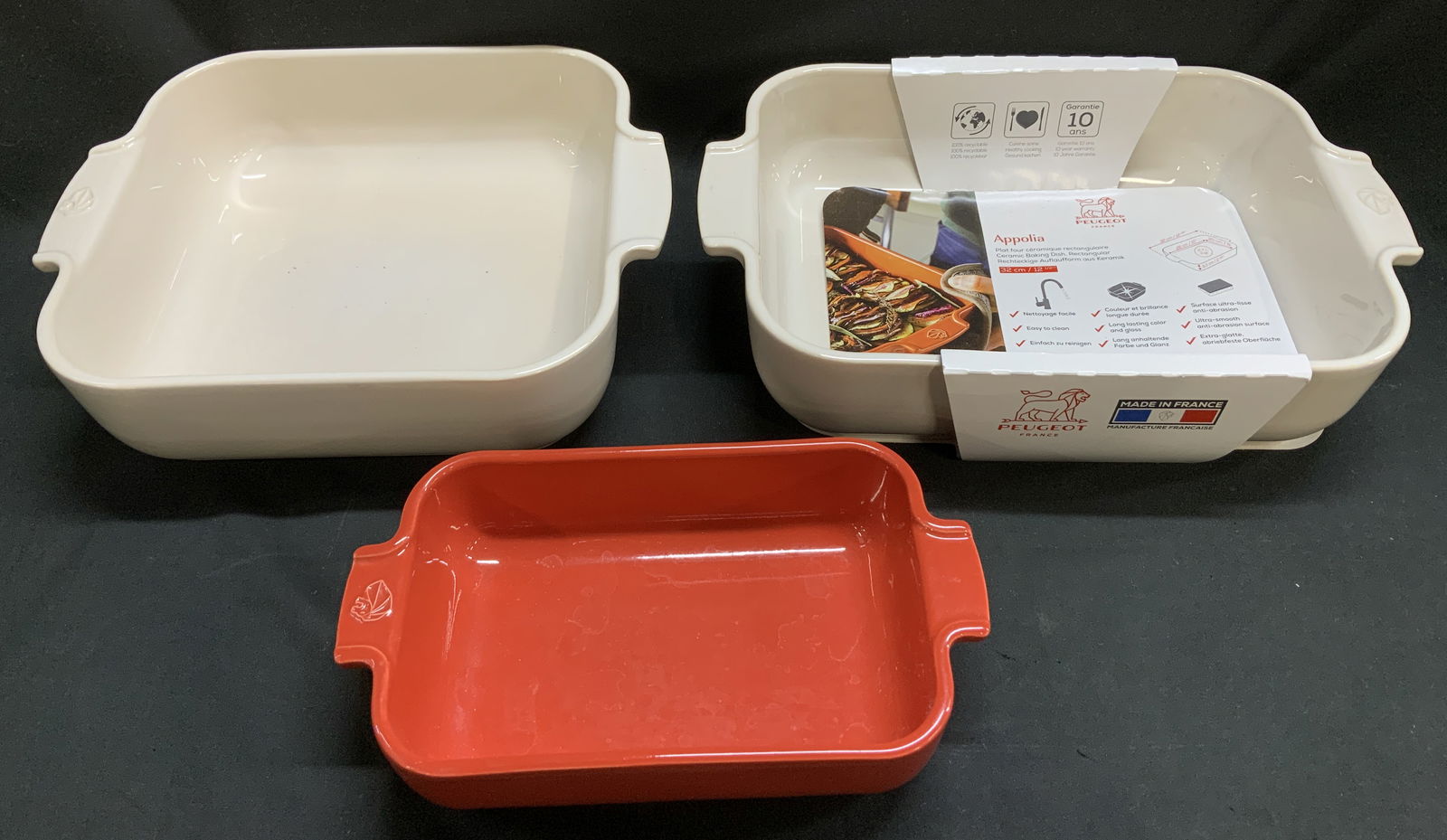 Lot 3 Peugeot Ceramic Baking Dishes FRANCE: Lot includes, 3 Peugeot rectangular & square ceramic baking dish. Shades of red & white. Assorted sizes. Sold as is. Signed & marked. Reads, PEUGEOT MADE IN FRANCE. Measurements of biggest baking dish