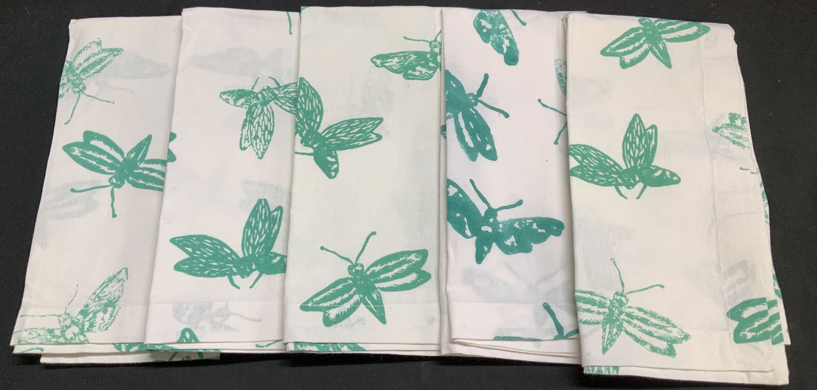 Lot 5 Textiles Home John Robshaw Tea Towels INDIA: 100% cotton. Tea towels feature green insect motifs. Signed & marked. Reads, TEXTILES HOME. JOHN ROBSHAW SOUTH EAST ASIA. MADE IN INDIA. Surface wear consistent to age, use & exposure. Measurements: l