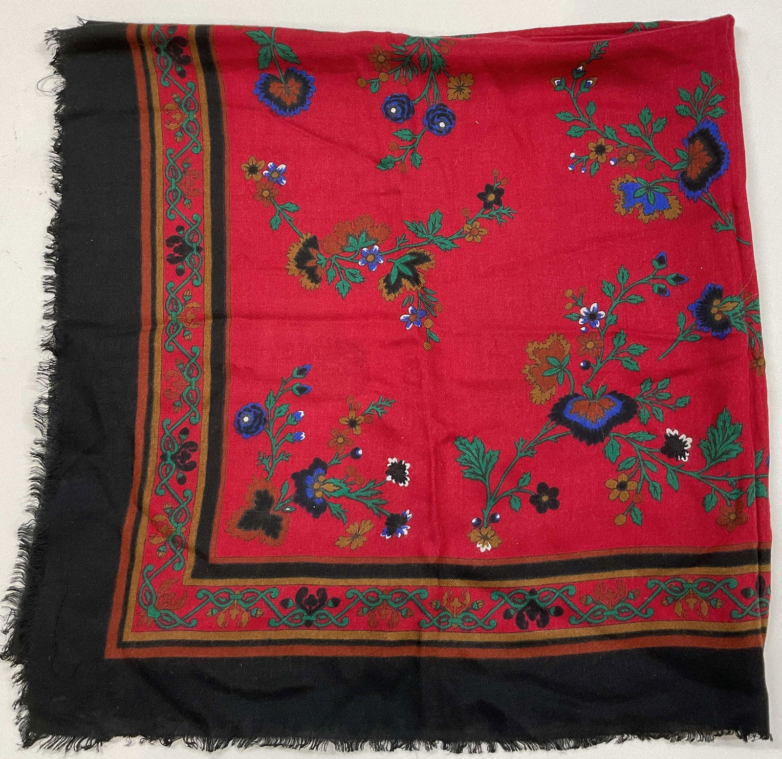 Vintage Floral Fringed Scarf: Vintage floral fringed scarf. Feels like cotton. Black fringed trim. Floral and scroll motifs. Red, blue, green, white, etc. Measures approx 33 x 34 inches. Wear consistent with exposure. Scarf, vinta