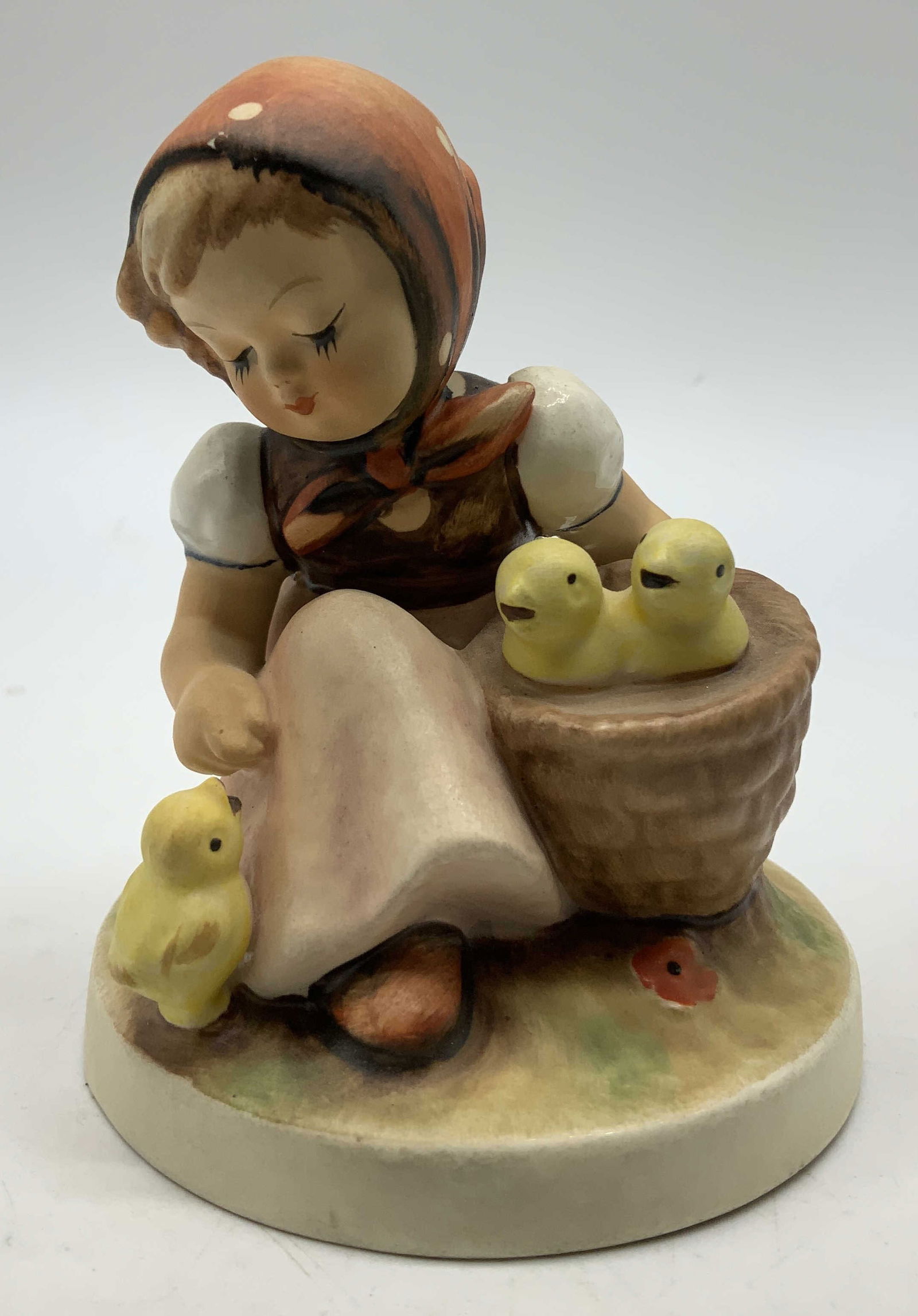 Vtg Goebel Chick Girl Ceramic Fig W GERMANY: Vintage Goebel ceramic figurine depicting a girl with small yellow chicks in a basket & at her side. Signed & marked on underside. Reads, W. GERMANY. Surface wear consistent to age, use & exposure. Me