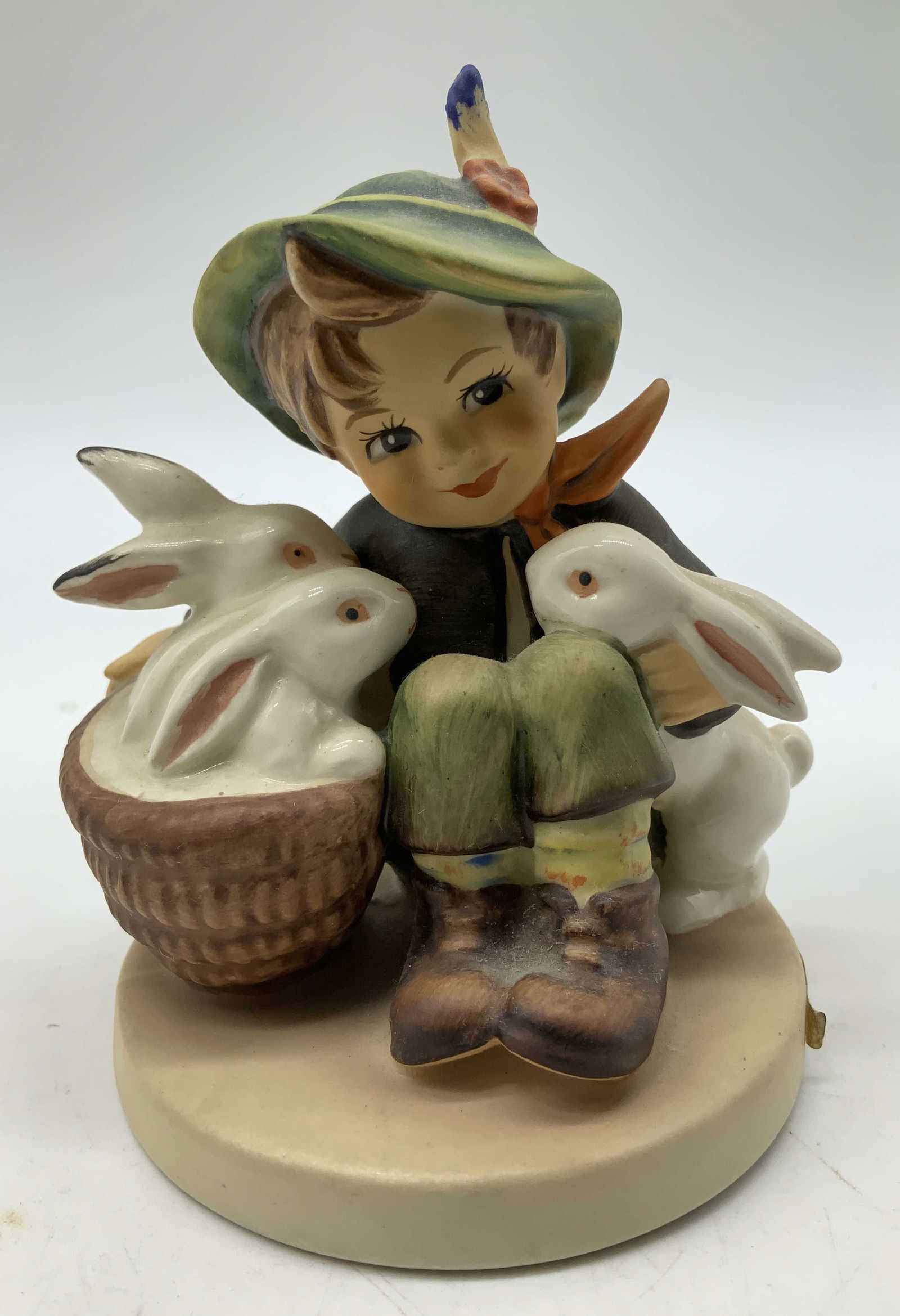 Vtg Goebel Playmates Ceramic Fig W GERMANY: Vintage Goebel ceramic figurine depicting a young boy sitting with three white bunnies. Signed & marked on underside. Reads, GOEBEL. W GERMANY. Surface wear consistent to age, use & exposure. Measurem