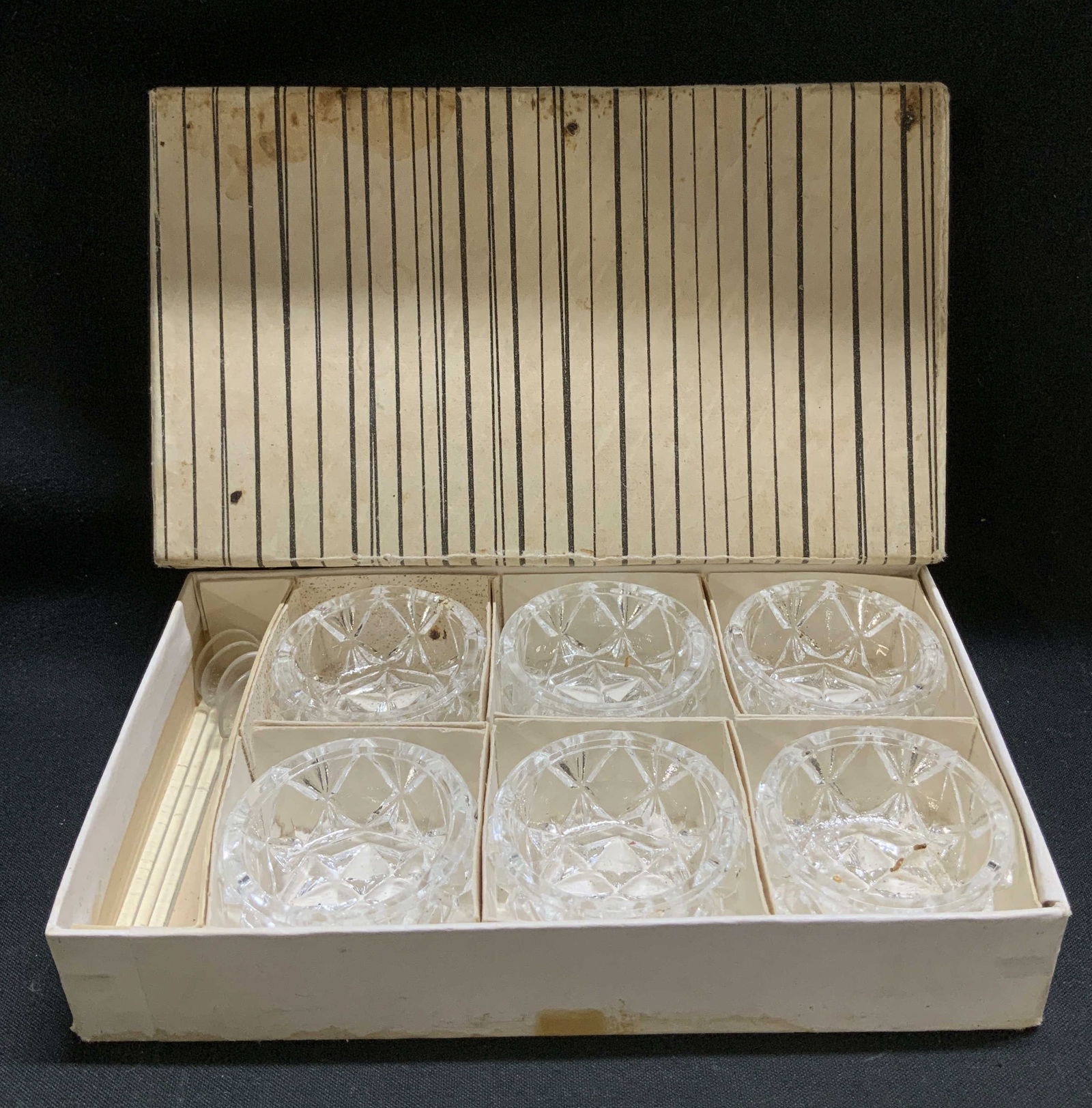 Set 10 Cut Crystal Salt Cellars & Spoons W Bx: Lot includes, 6 crystal salt cellars featuring intricate cuts & 4 spoons. Comes with striped box. Signed & marked on underside of box. Reads, MADE IN CZECHOSLOVAKIA. Surface wear consistent to