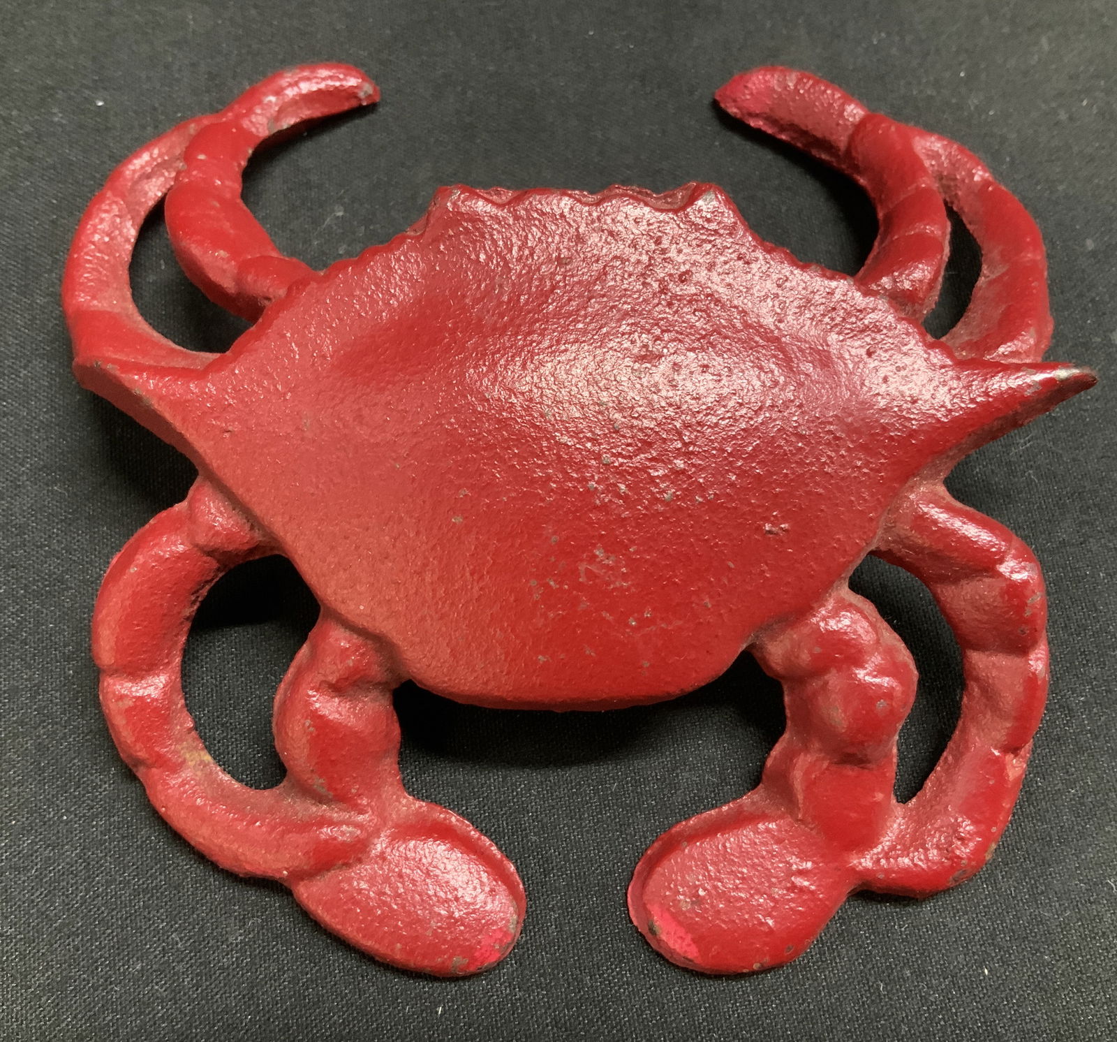 Virginia Beach Cast Iron Crab Fig: Cast iron crab figurine/possible bottle opener feathers a red finish. Signed & marked on underside. Reads, VIRGINIA BEACH. Surface wear consistent to age, use & exposure. Measurements: length
