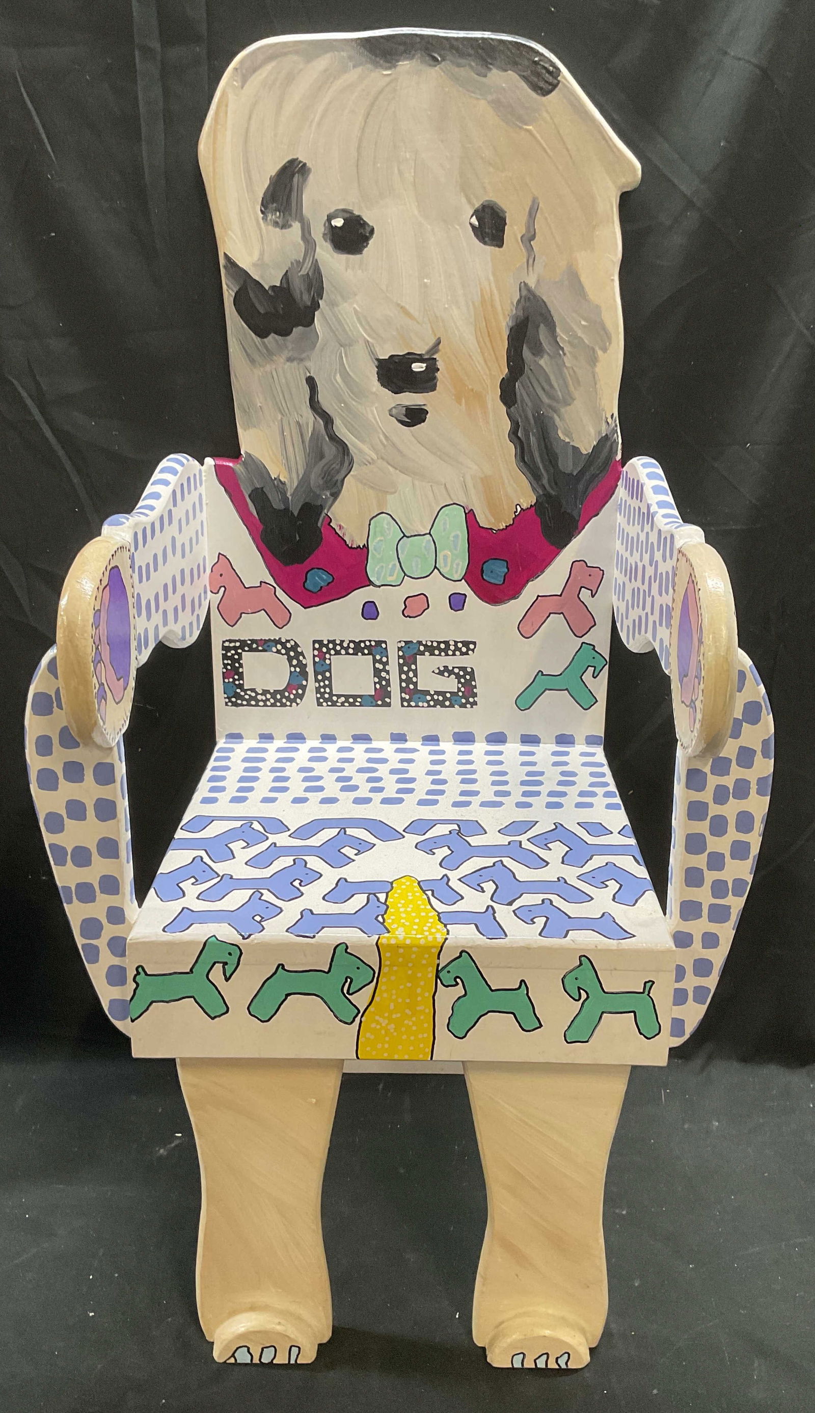 Laura D Folk Art Hand Painted Dog Chair USA 1991: Signed Laura D Folk Art Furniture handmade arm chair. Hand painted wood with dog motif. Signed on reverse. Carmel, New York, 1991. Measures approx 14.5 x 13.5 x 34 inches. Some scratching and hairline