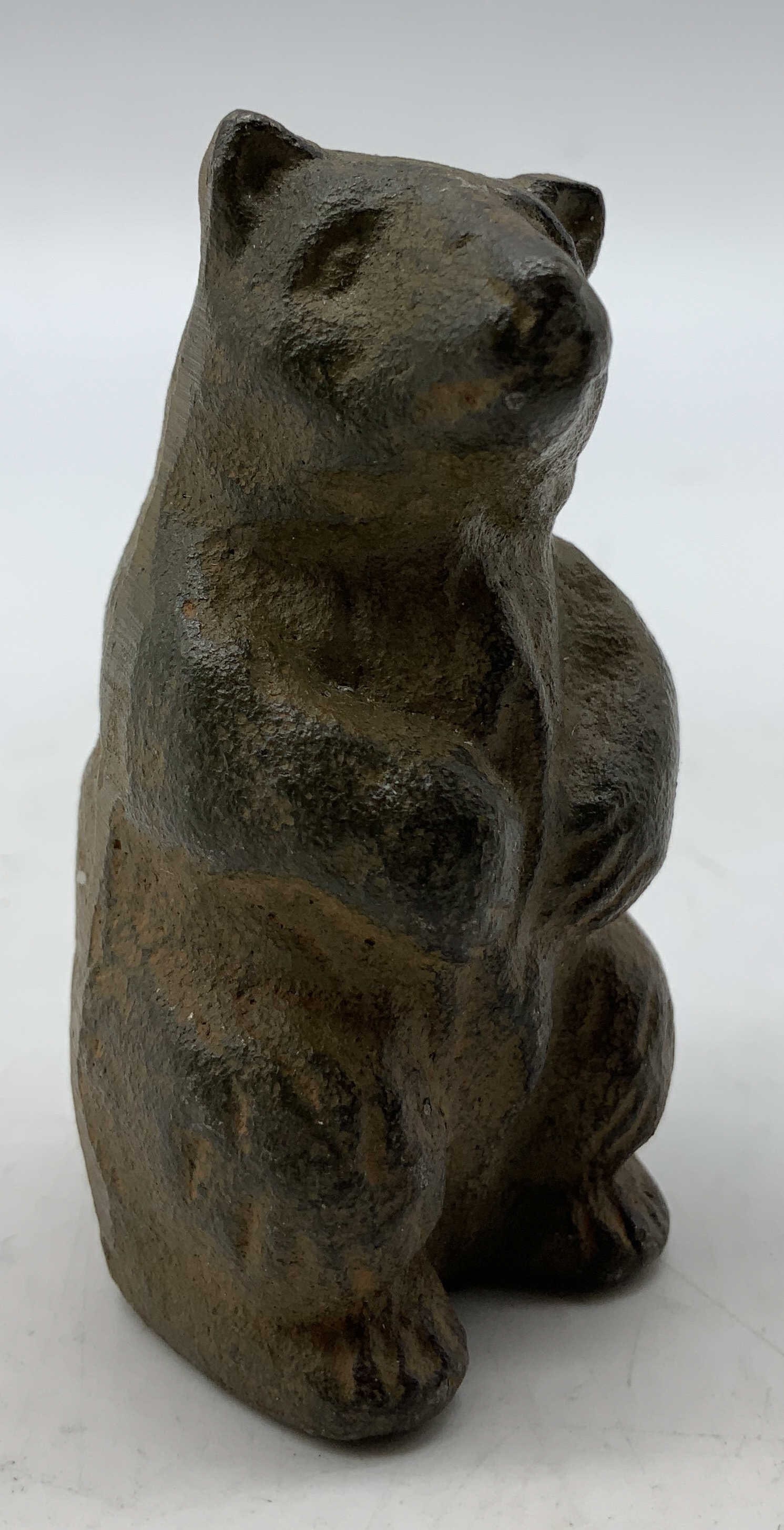 Vtg Cast Iron Bear Figurine: Vintage cast iron bear figurine. Bear is in an upright position. No visible signature or markings. Surface wear consistent to age, use & exposure. Measurements: length 1.3in x width 1.3in x height 2.6