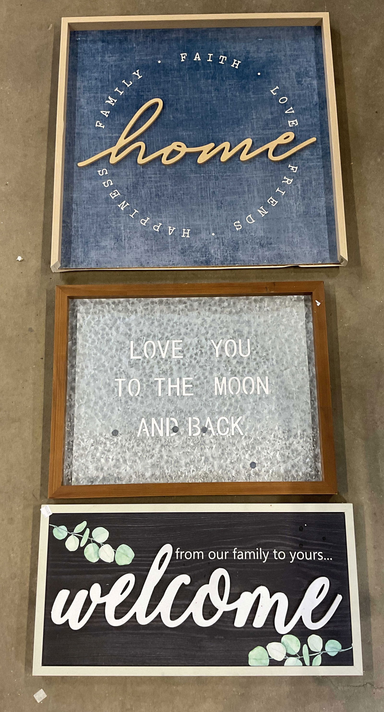 Lot 3 Framed Home Wall Sign Prints: Lot of 3 framed home wall sign prints on canvas and paper. Welcome, Home, and Love You motifs. Largest measures approx. 25 x 25 inches. One frame needs replacement. Some wear to all consistent with ex