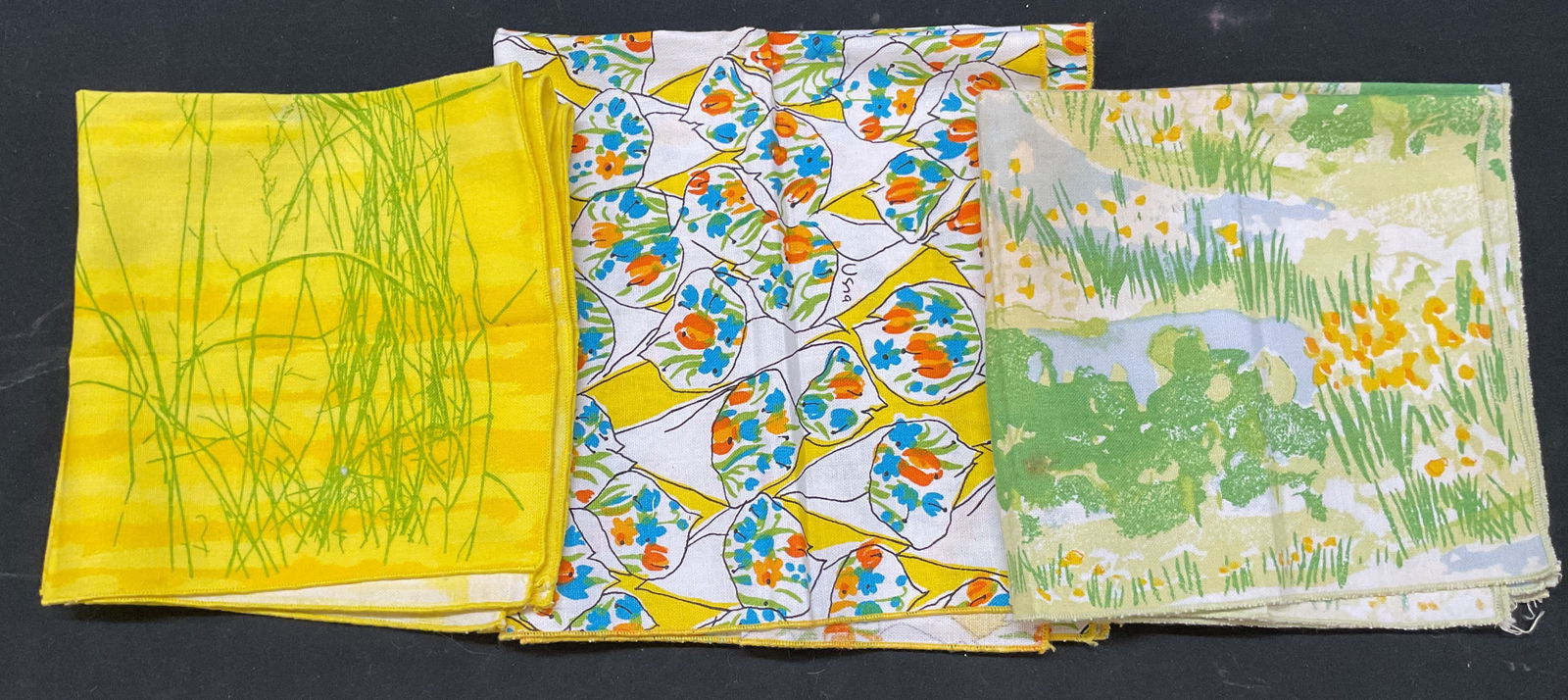 Lot 6 Vera Neumann Decorative Cotton Napkins: Lot of 6 Vera Neumann decorative cotton napkins. Cotton material. Signed. Colors consist of green, white, orange, yellow, and more. Features floral, grass, water, and geometric motifs. Measures approx