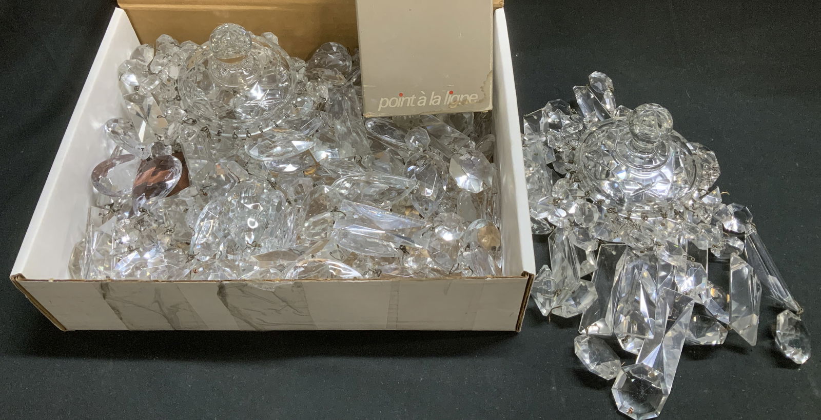 Lot 30+ Vtg Crystal Chandelier Prisms: Lot includes 30+ vintage crystal chandelier prisms. Pieces vary in size & shape. Comes with a bag of screws. Surface wear consistent to age, use & exposure. No visible signature or markings.