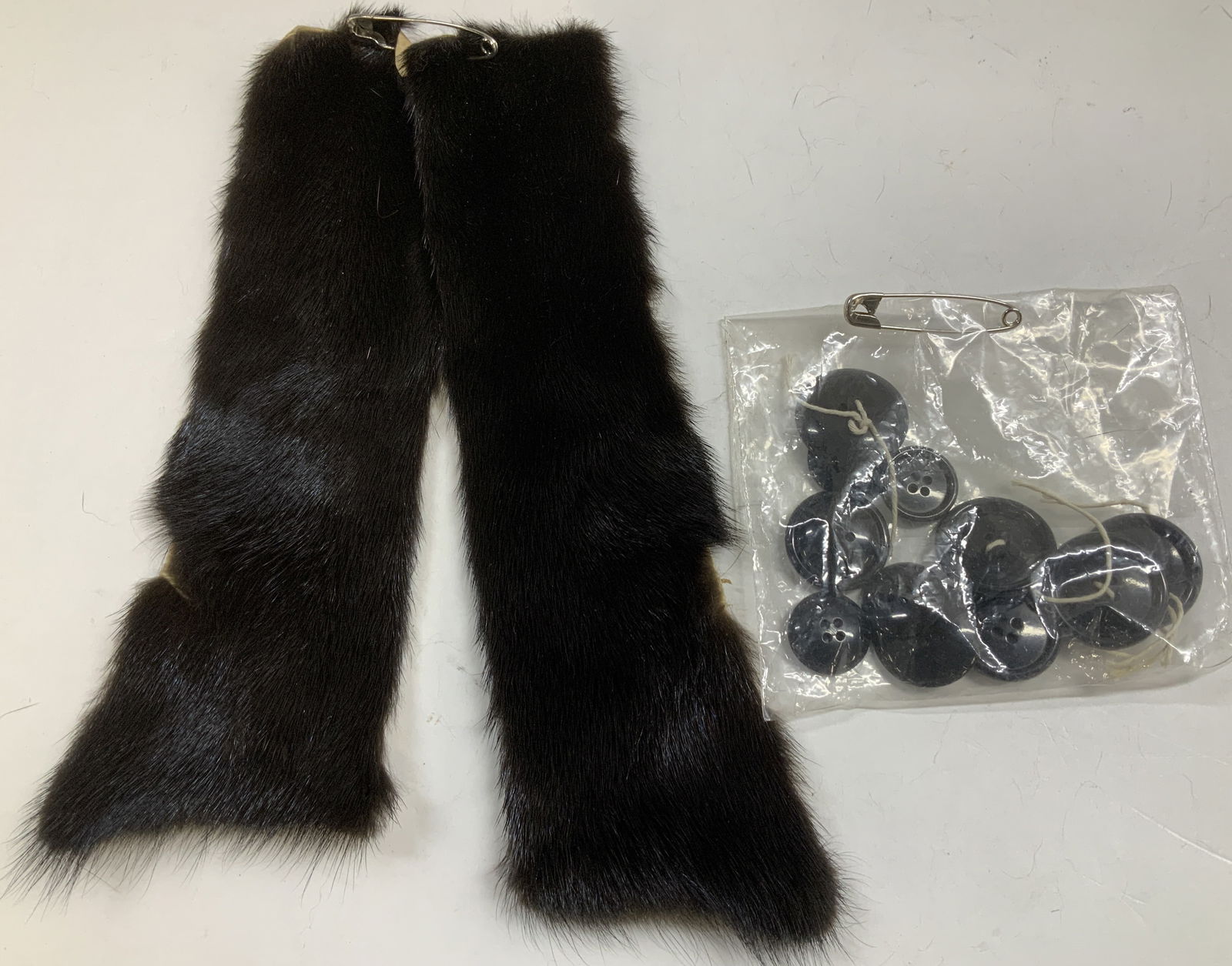 Group Lot 14 Mink Fur Remnants & Buttons: Lot includes, 2 dark toned mink fur remnants. Comes with 12 black buttons. Lot is sold as is. No visible signature or markings. Surface wear consistent to age, use & exposure. Measurements of