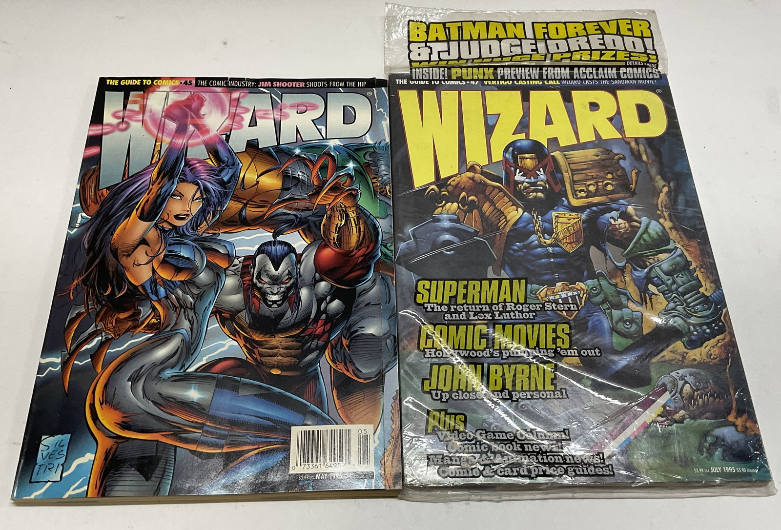 Lot 2 Wizard Magazines 1995: Lot of 2 Wizard Magazines from 95. Features Wizard Magazine #47 sealed in package and includes a small holographic poster and Wizard Magazine #45 which contains a pull-out poster. Various guides to co