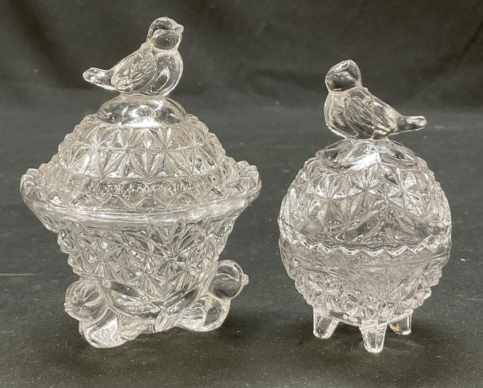 Lot 2 Hofbauer Crystal Byrdes Footed Trinket Box: Lot of 2 items. From the Hofbauer crystal Byrdes collection. Lidded and footed trinket boxes. Round bowl shape. Sawtooth edges. Decorative bird finial on lid. Cut starburst pattern. Bird figure feet o